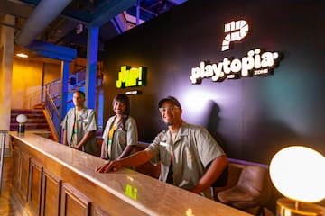 a group of people standing at a counter