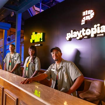 a group of people standing at a counter