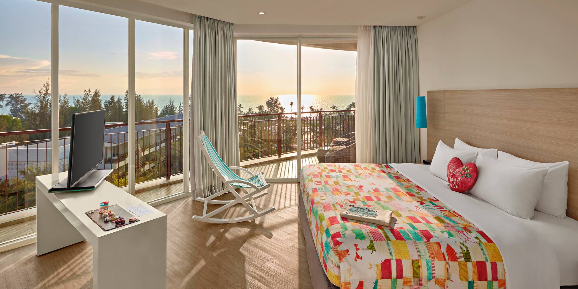 a room with a bed and a television