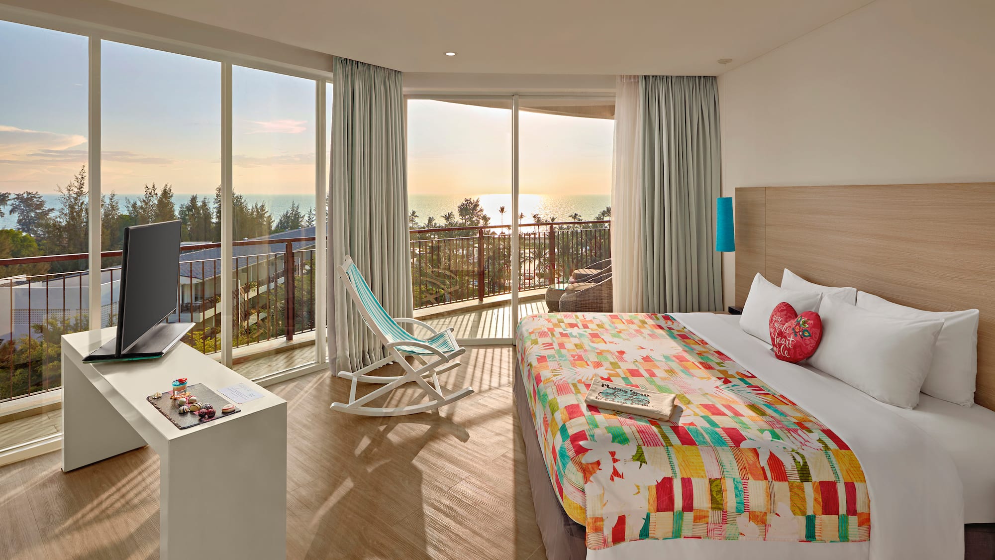 a room with a bed and a television