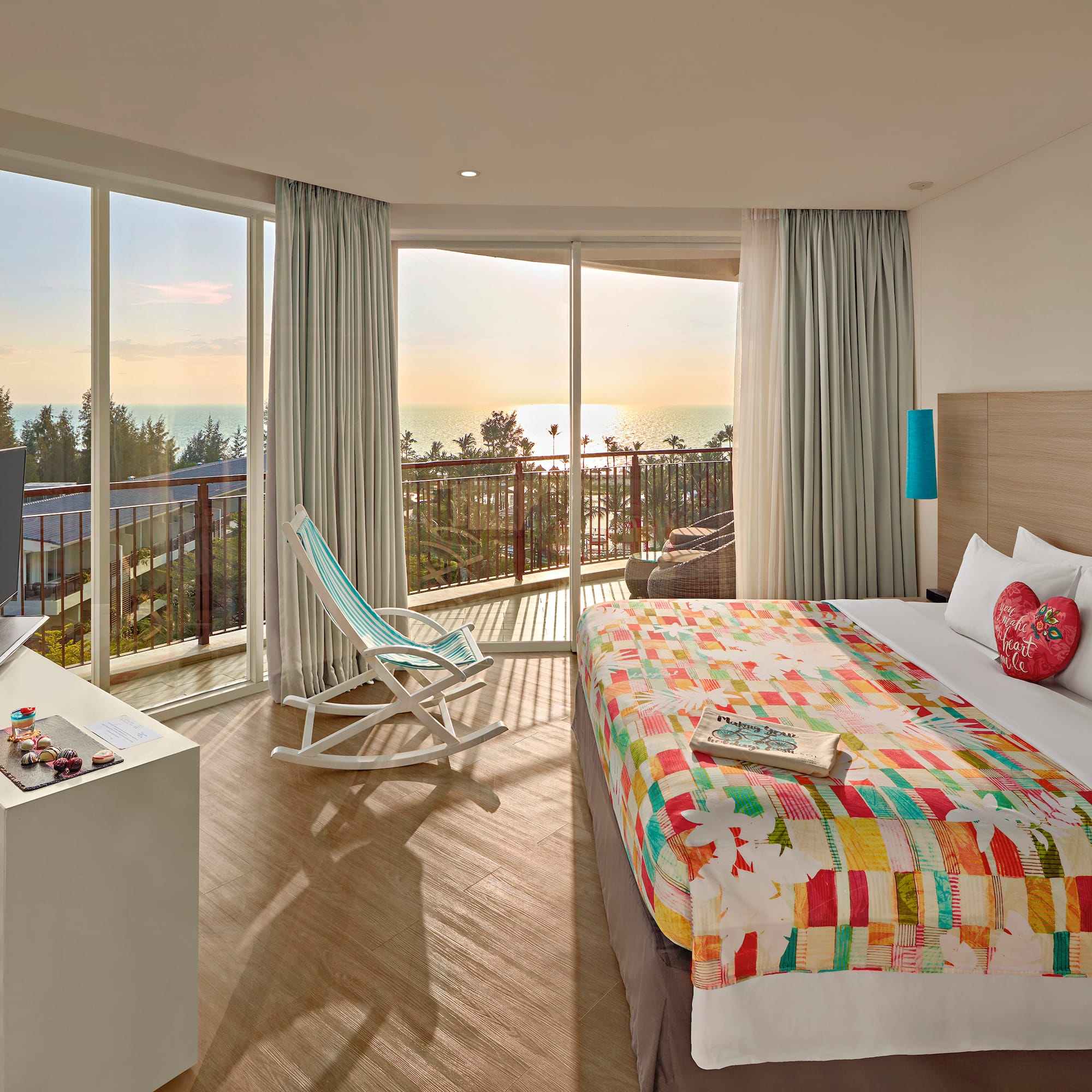 a room with a bed and a television