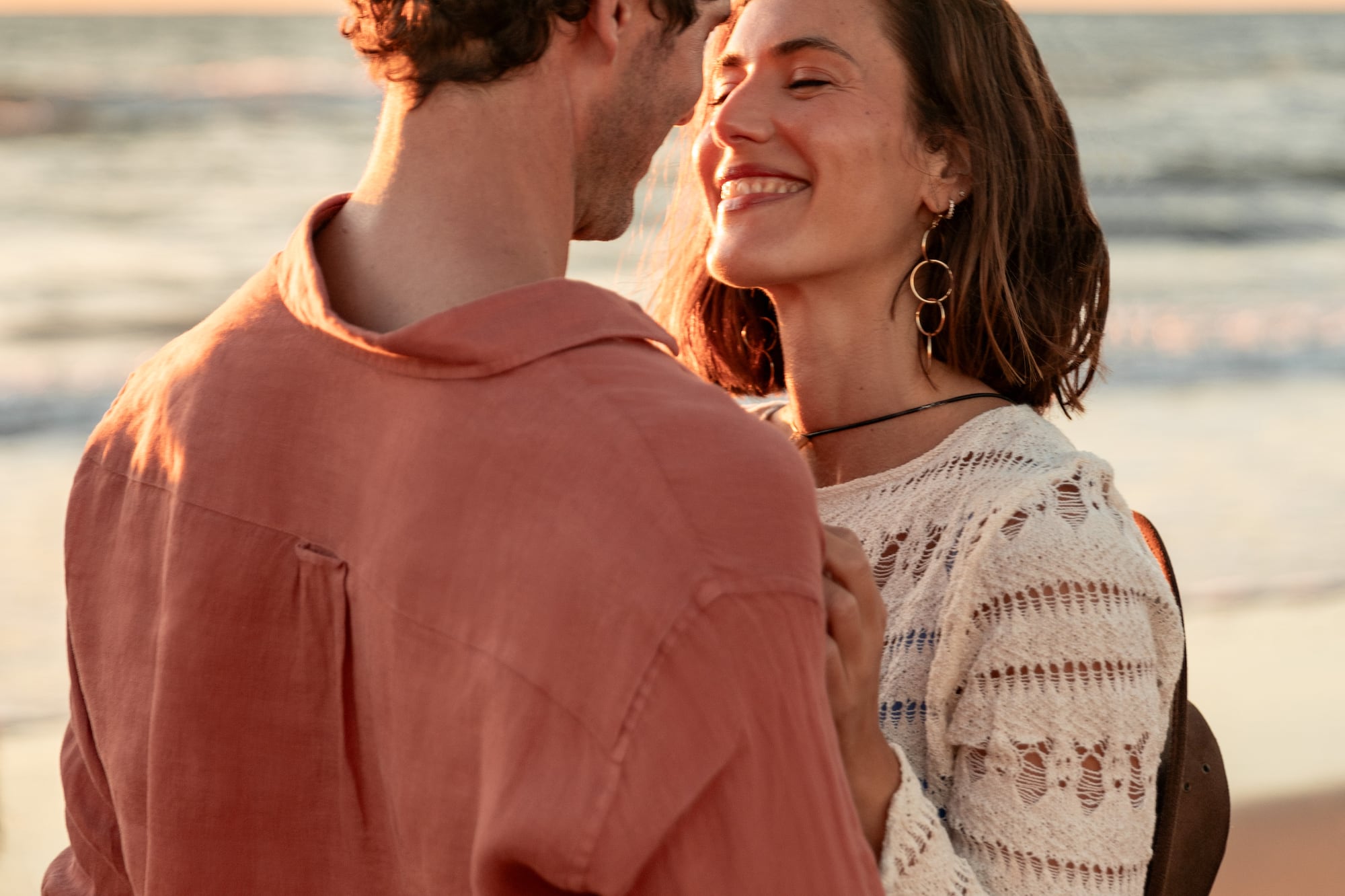 a man and woman on a beach