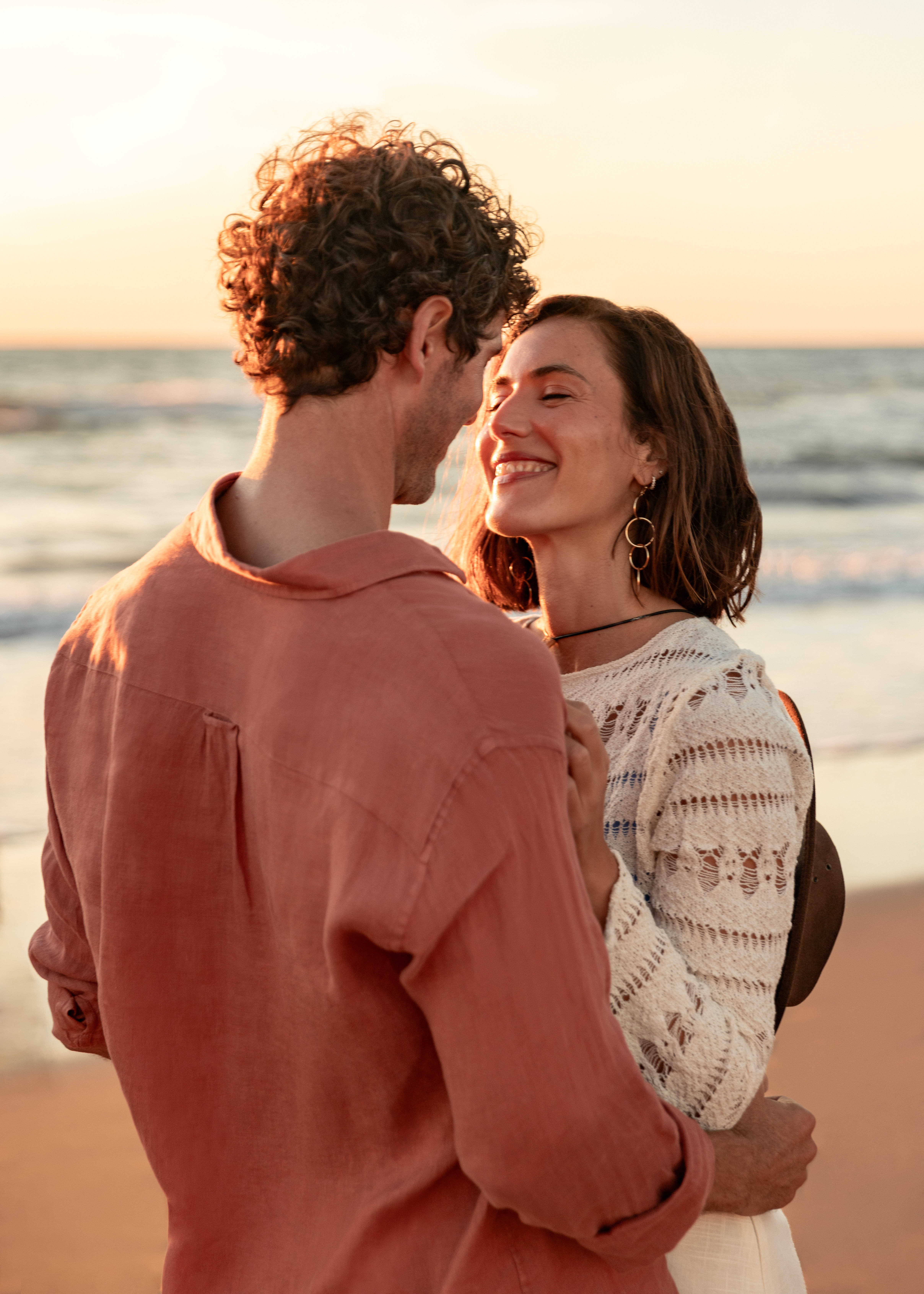 a man and woman on a beach