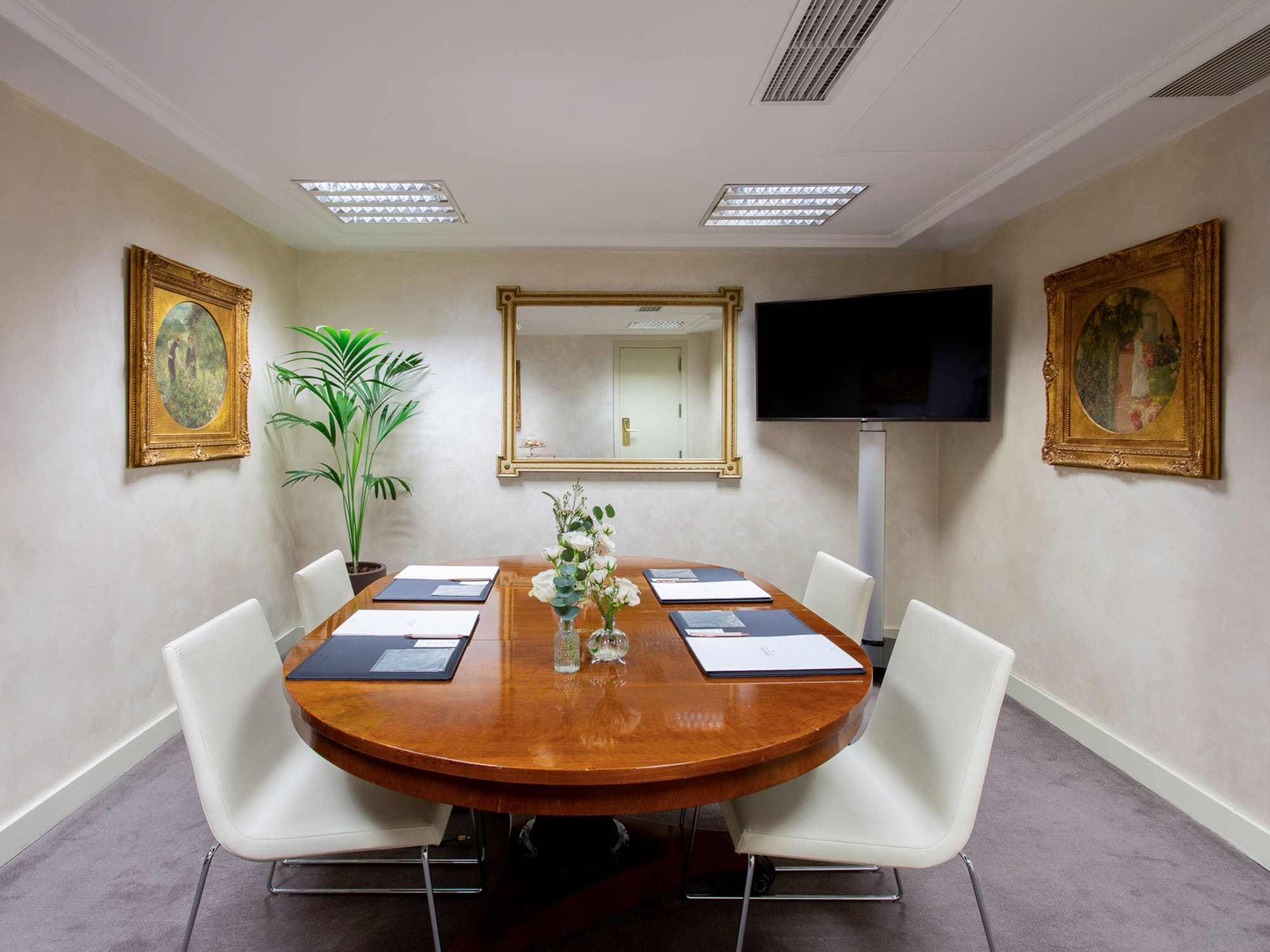 a room with a table and chairs