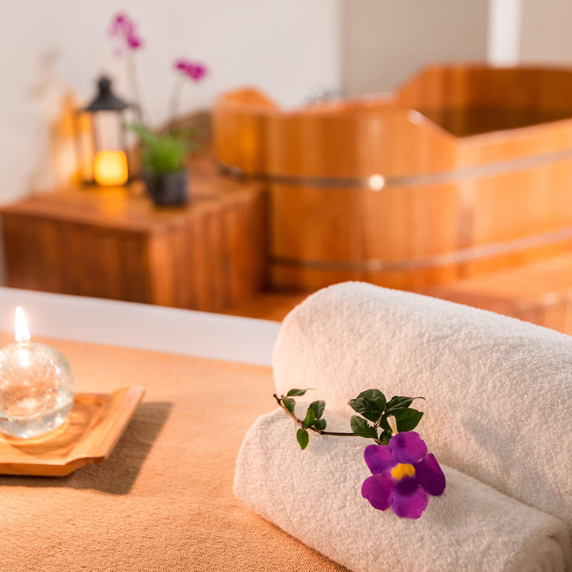 a towel and flower on a table