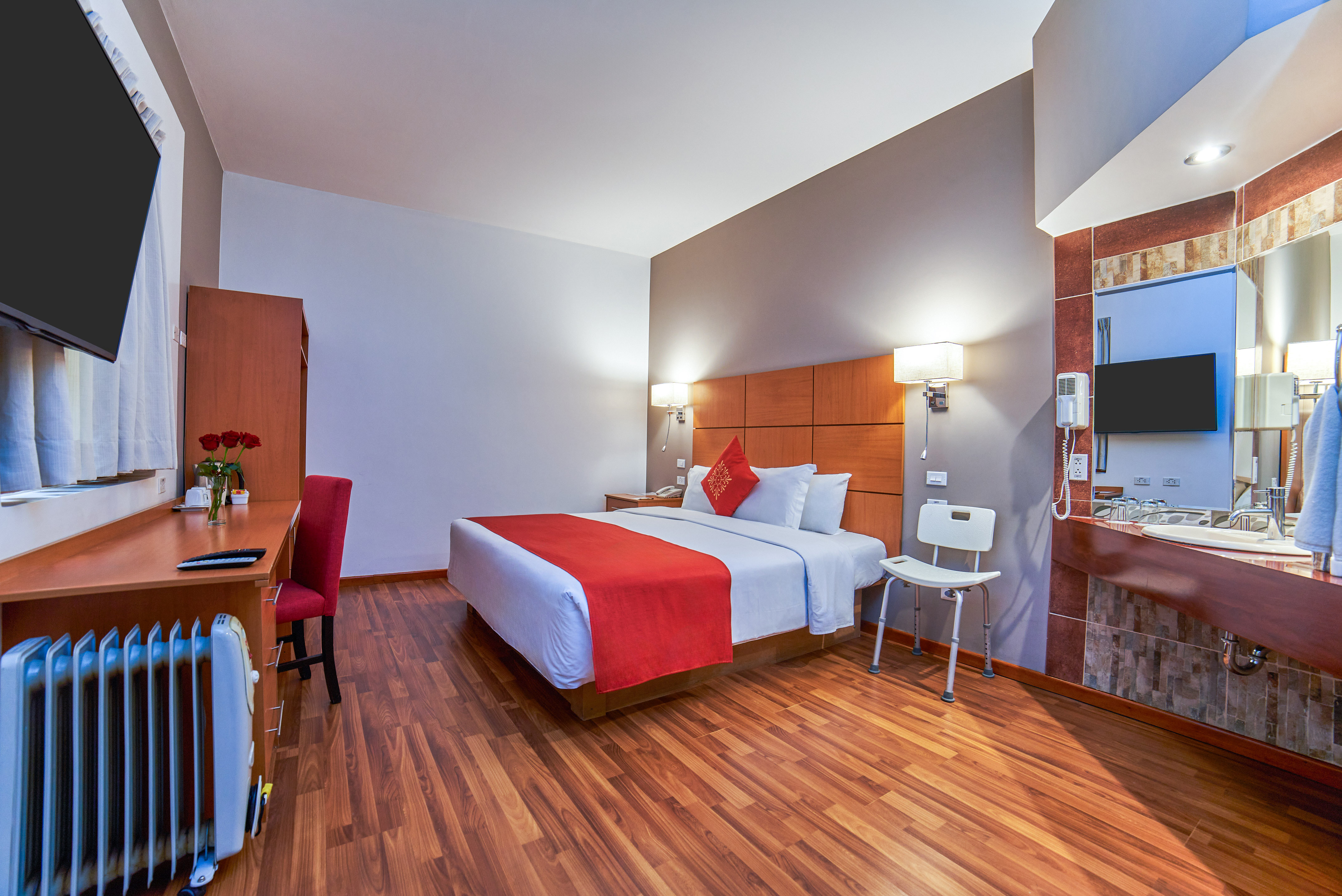 a room with a bed and a desk