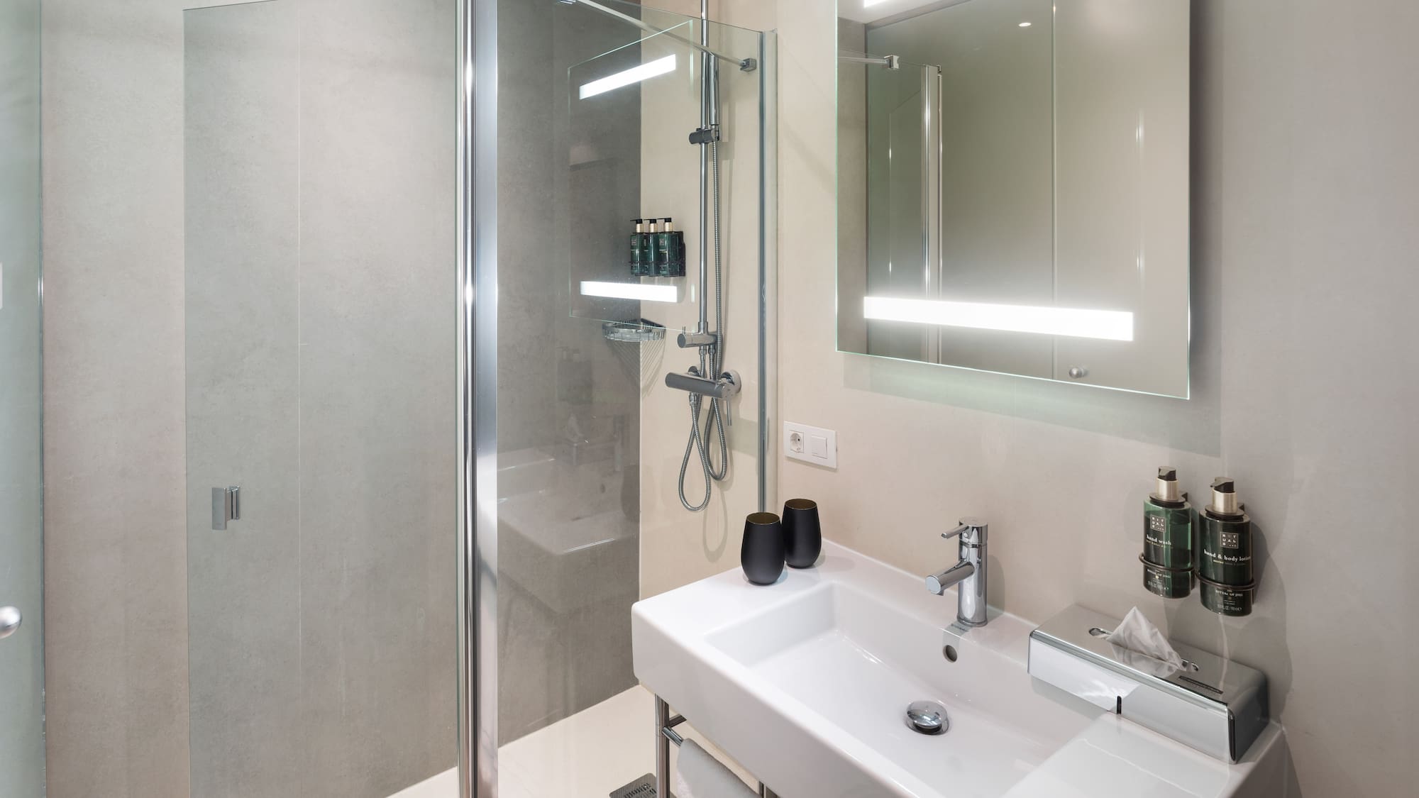 a bathroom with a shower and sink