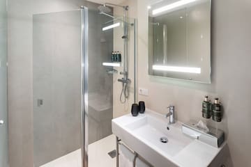 a bathroom with a shower and sink