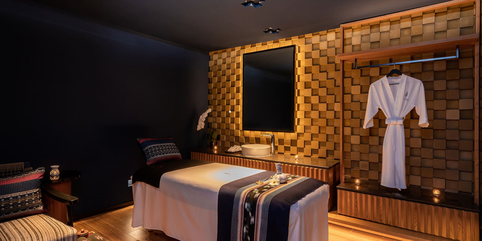 a room with a bed and a mirror