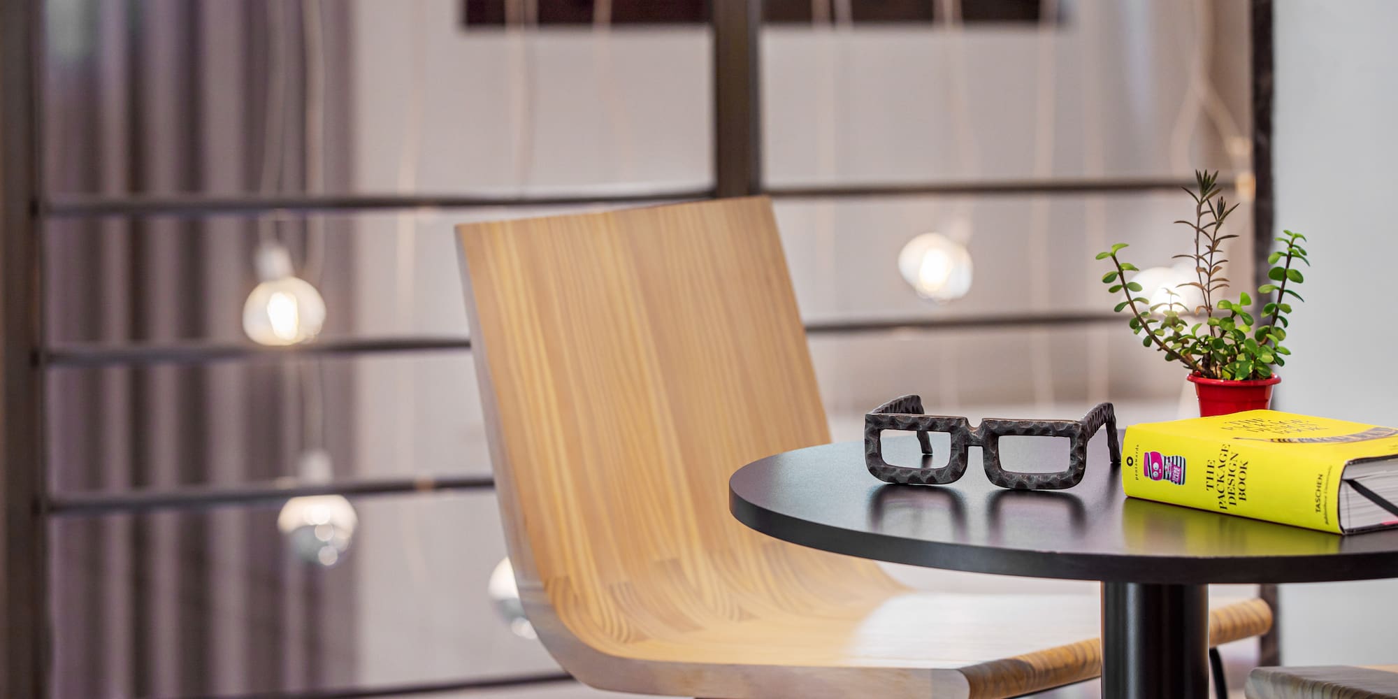 a chair and table with glasses on it