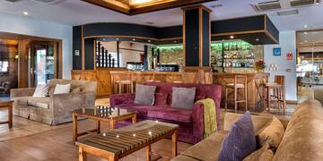 a room with a bar and a couch