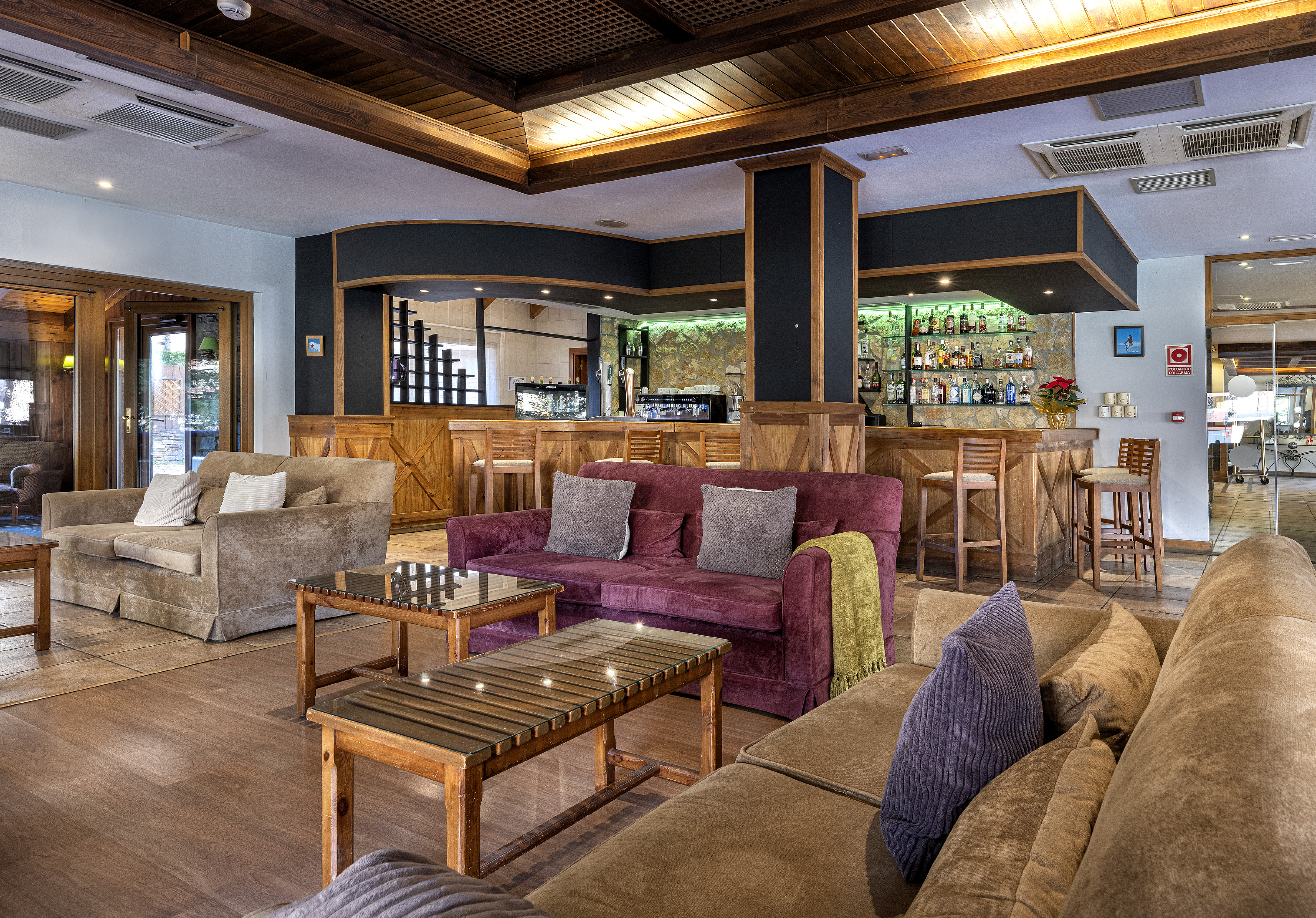 a room with a bar and a couch