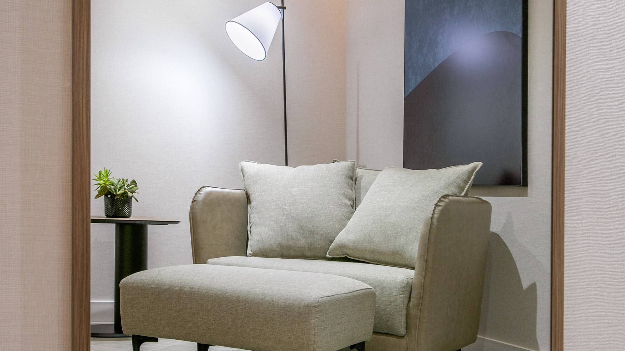 a chair and a lamp in a room