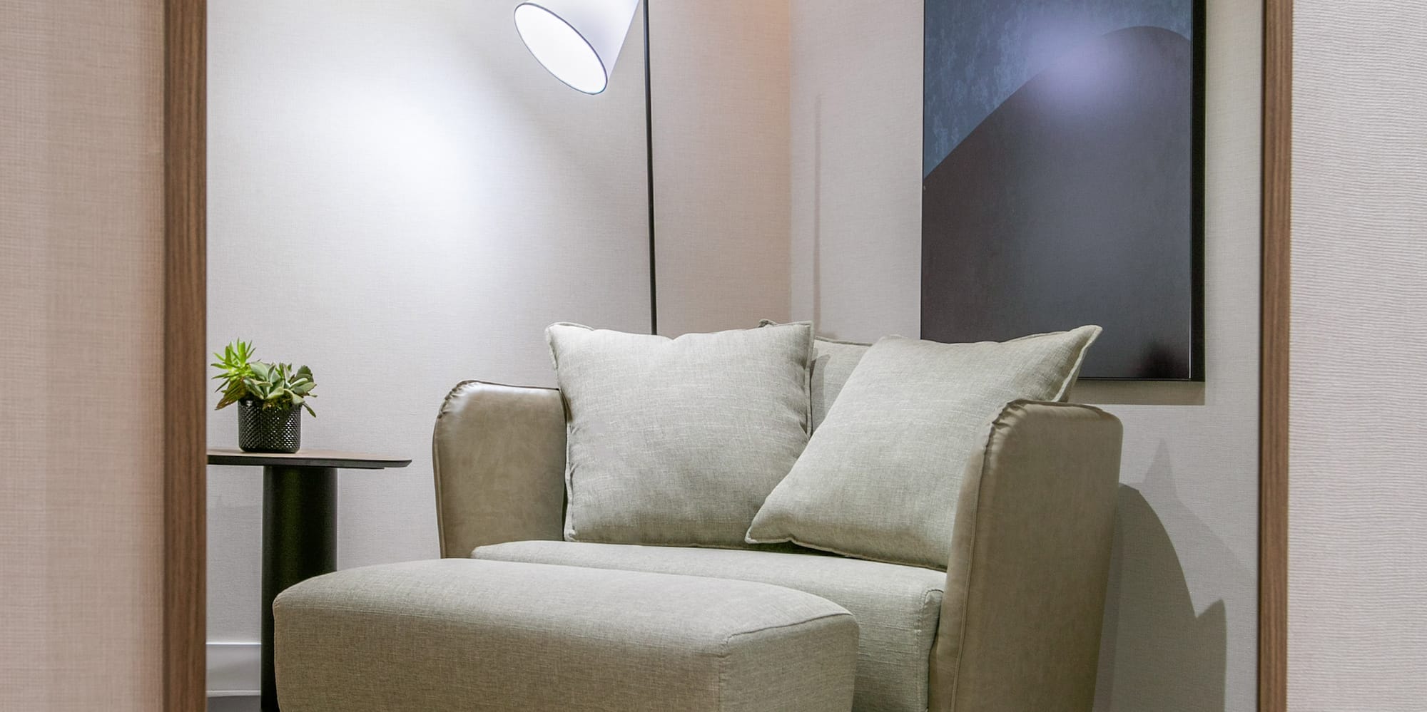 a chair and a lamp in a room