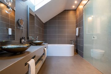 a bathroom with a shower and sink