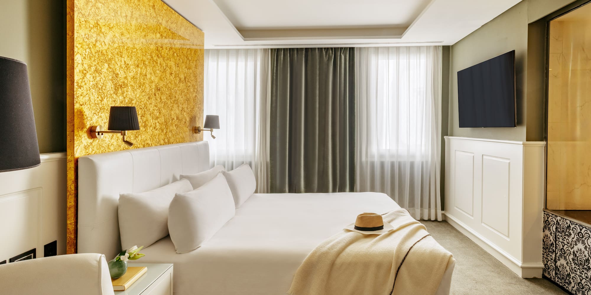 a bed with a hat on it