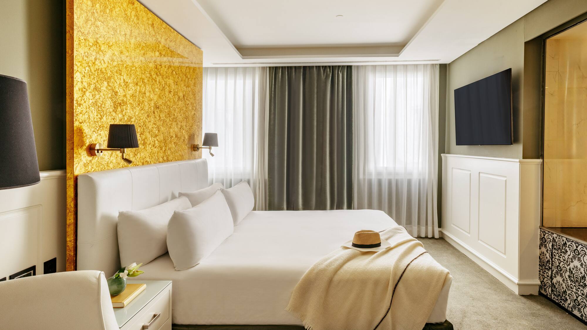 a bed with a hat on it