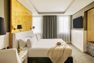 a bed with a hat on it