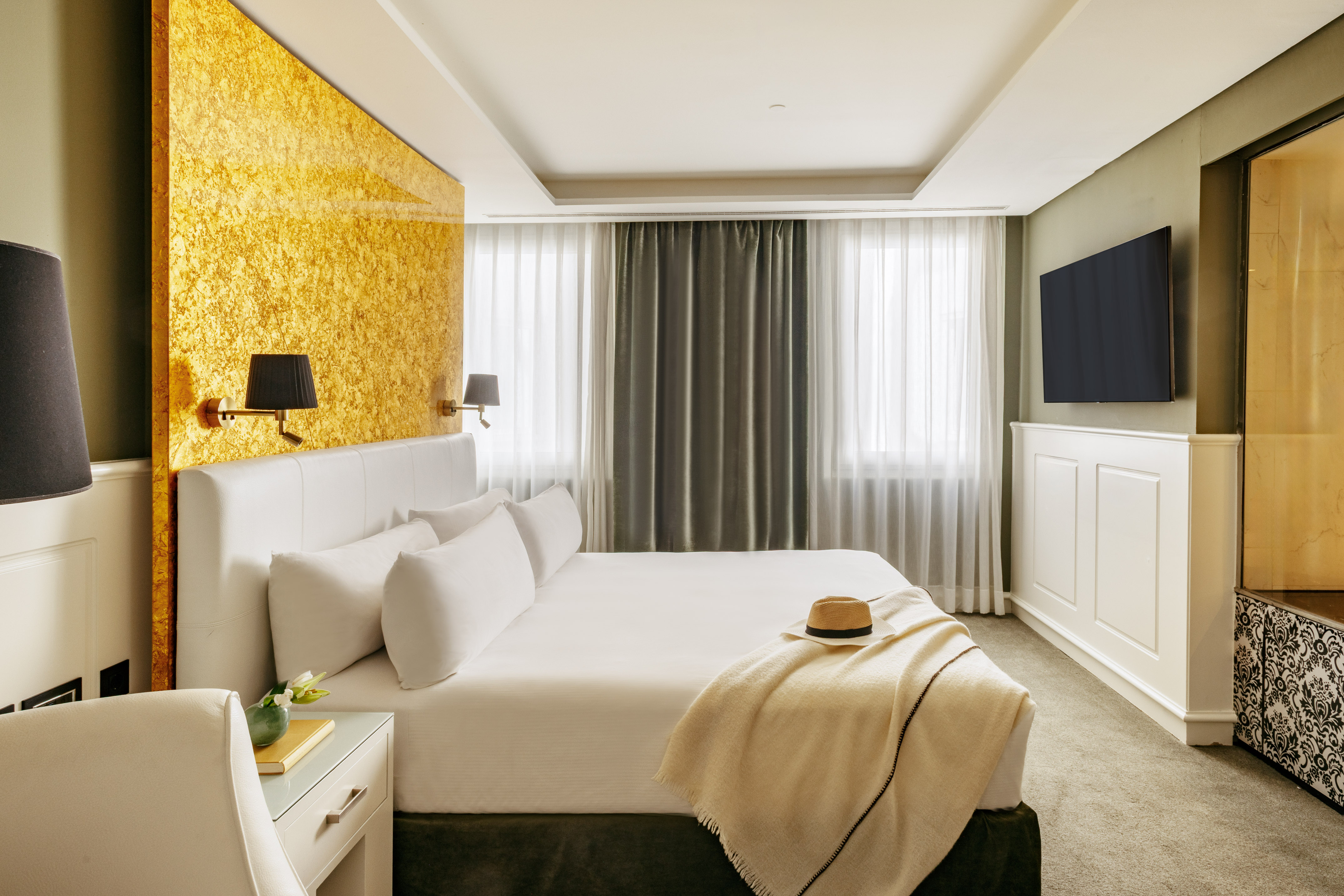 a bed with a hat on it