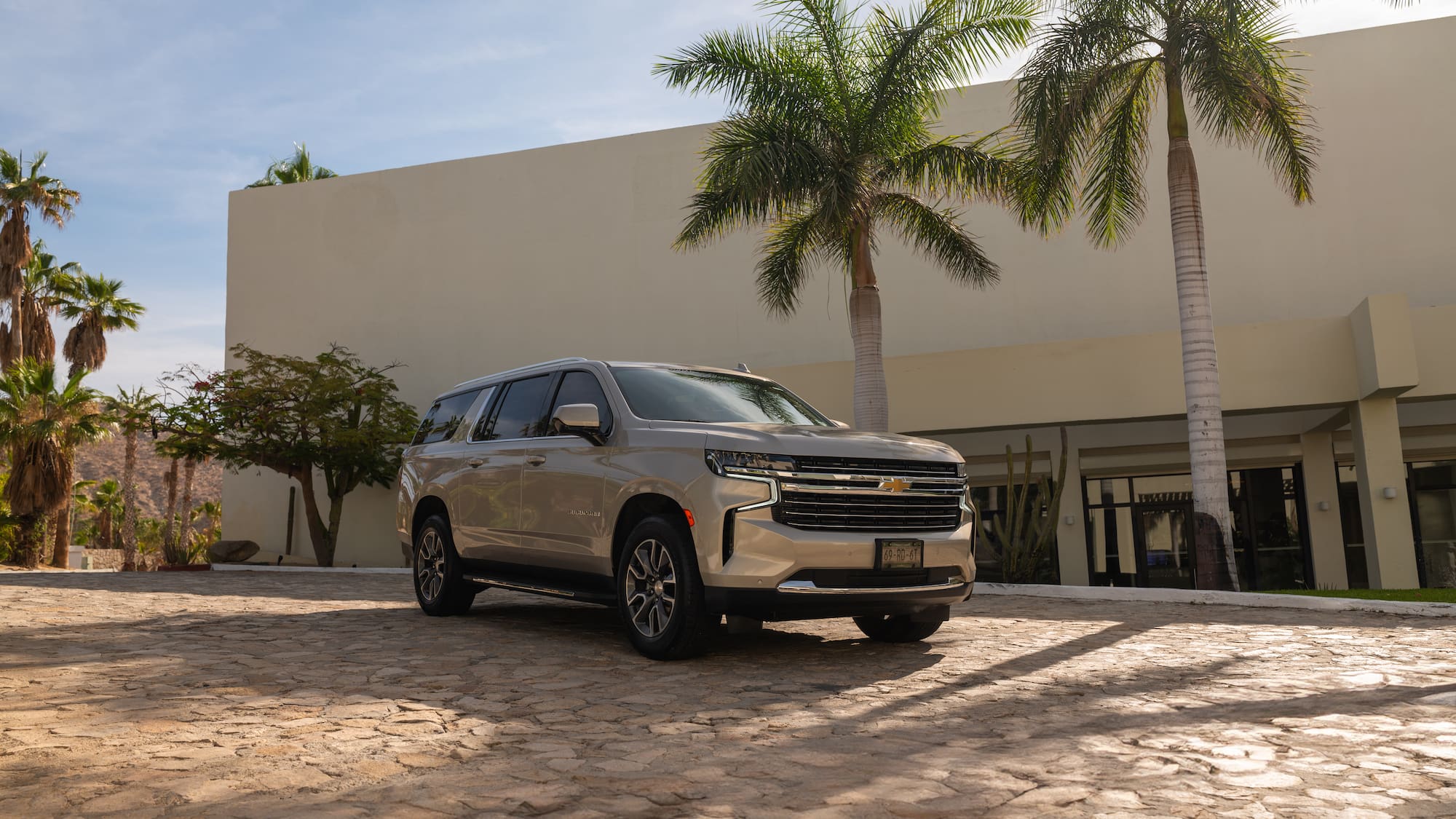 a silver car parked in front of a building