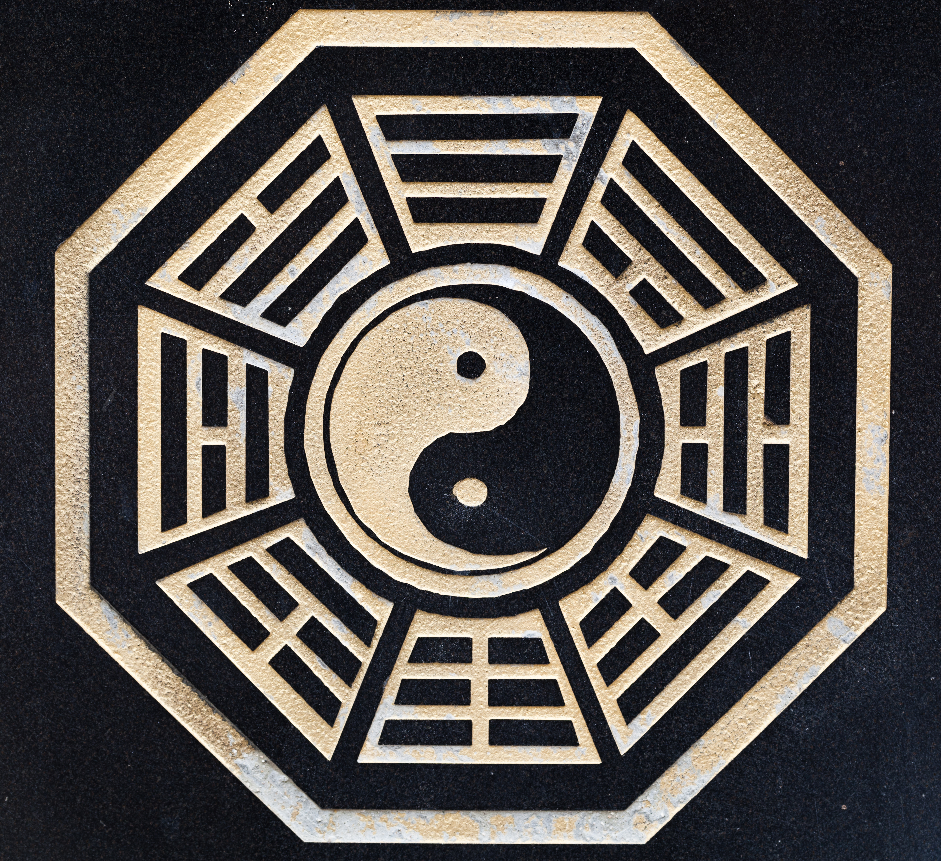 a symbol on a black surface