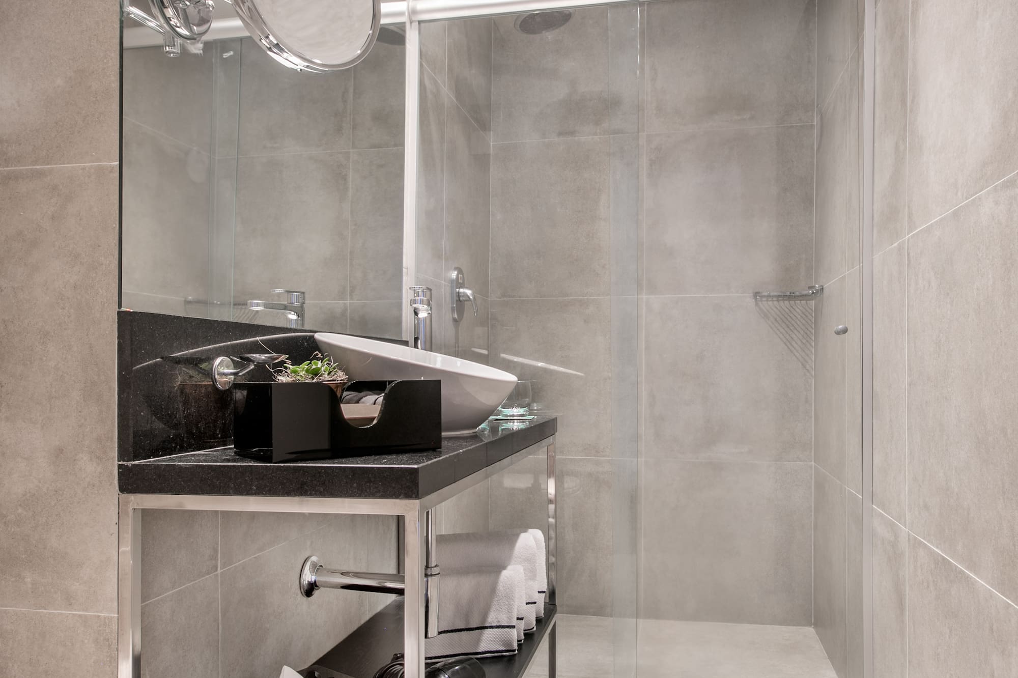 a bathroom with a glass shower door