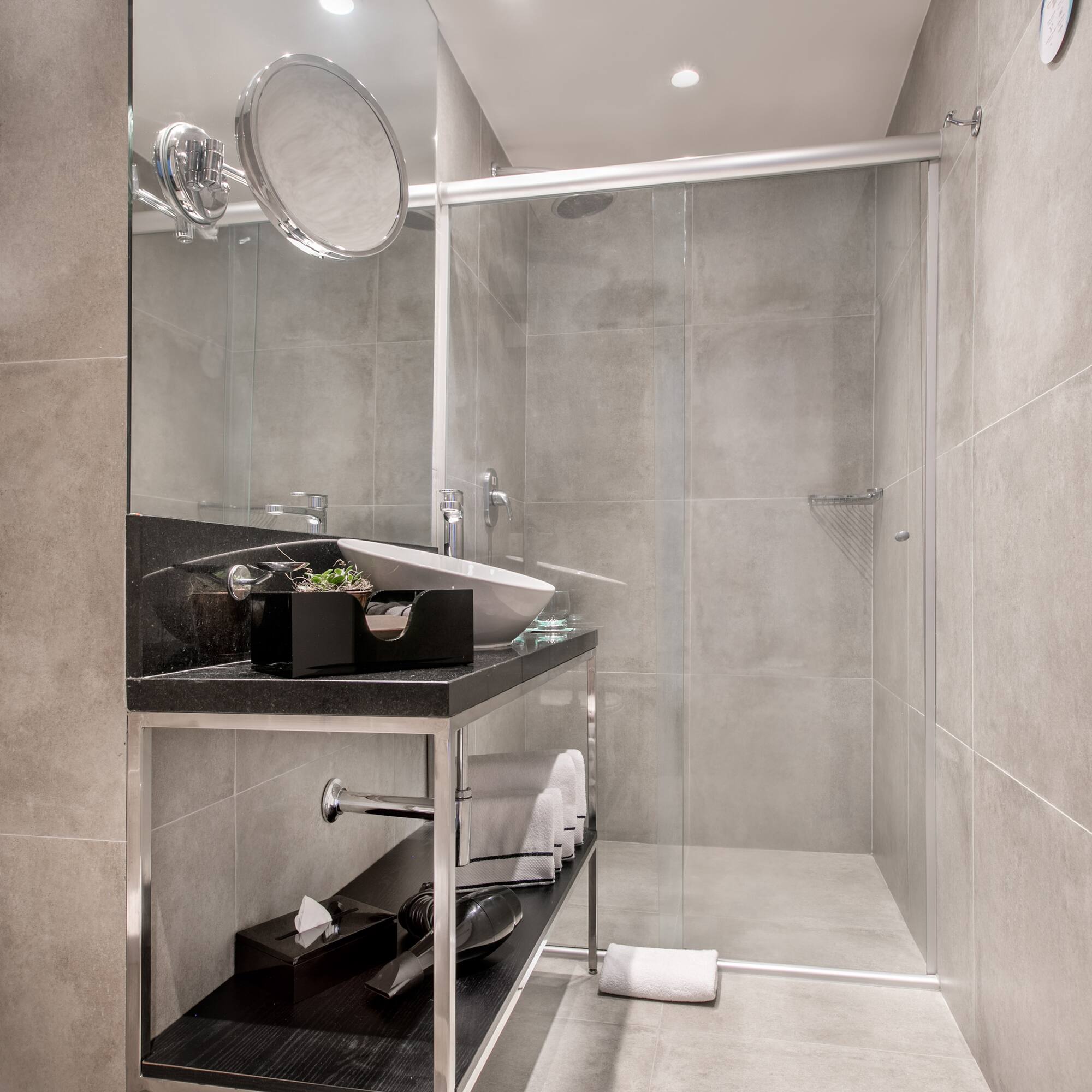 a bathroom with a glass shower door
