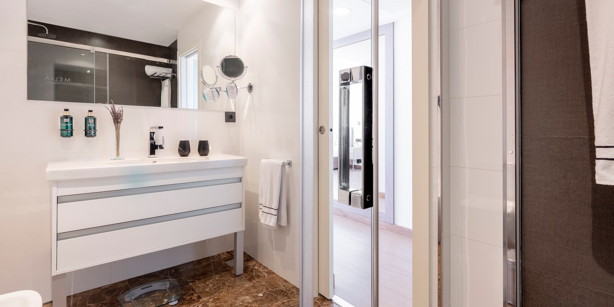 a bathroom with a glass door