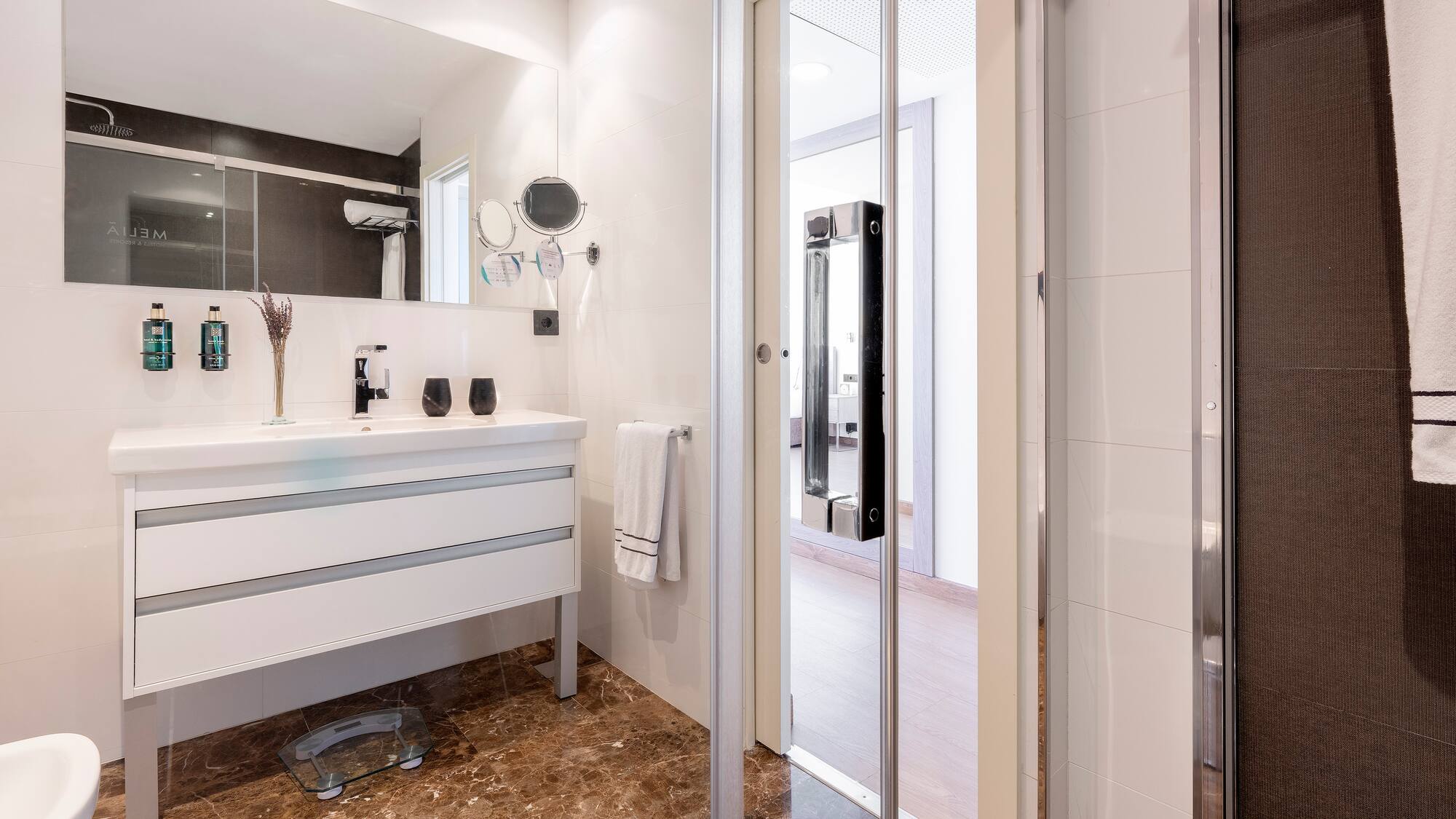 a bathroom with a glass door