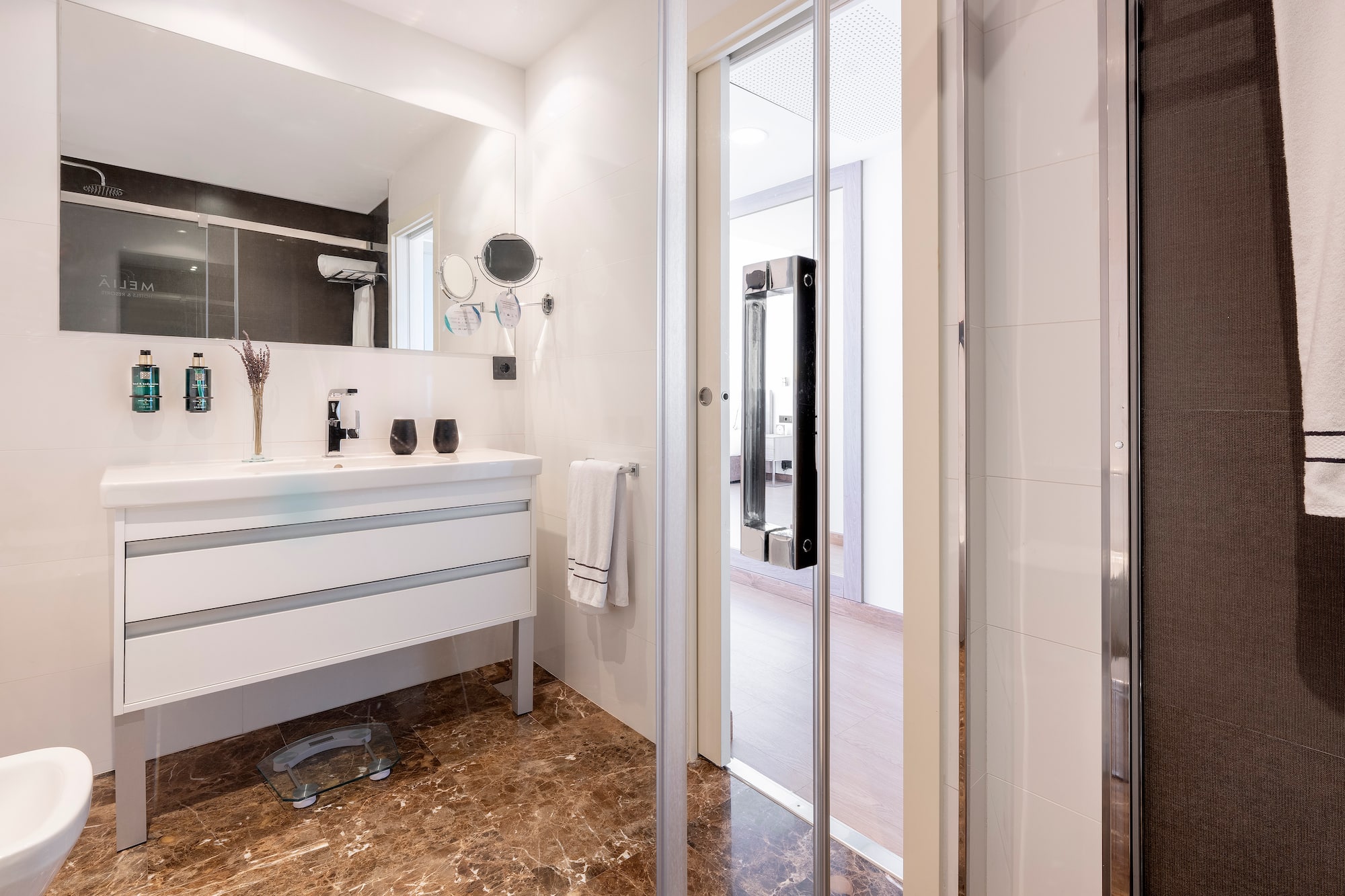 a bathroom with a glass door