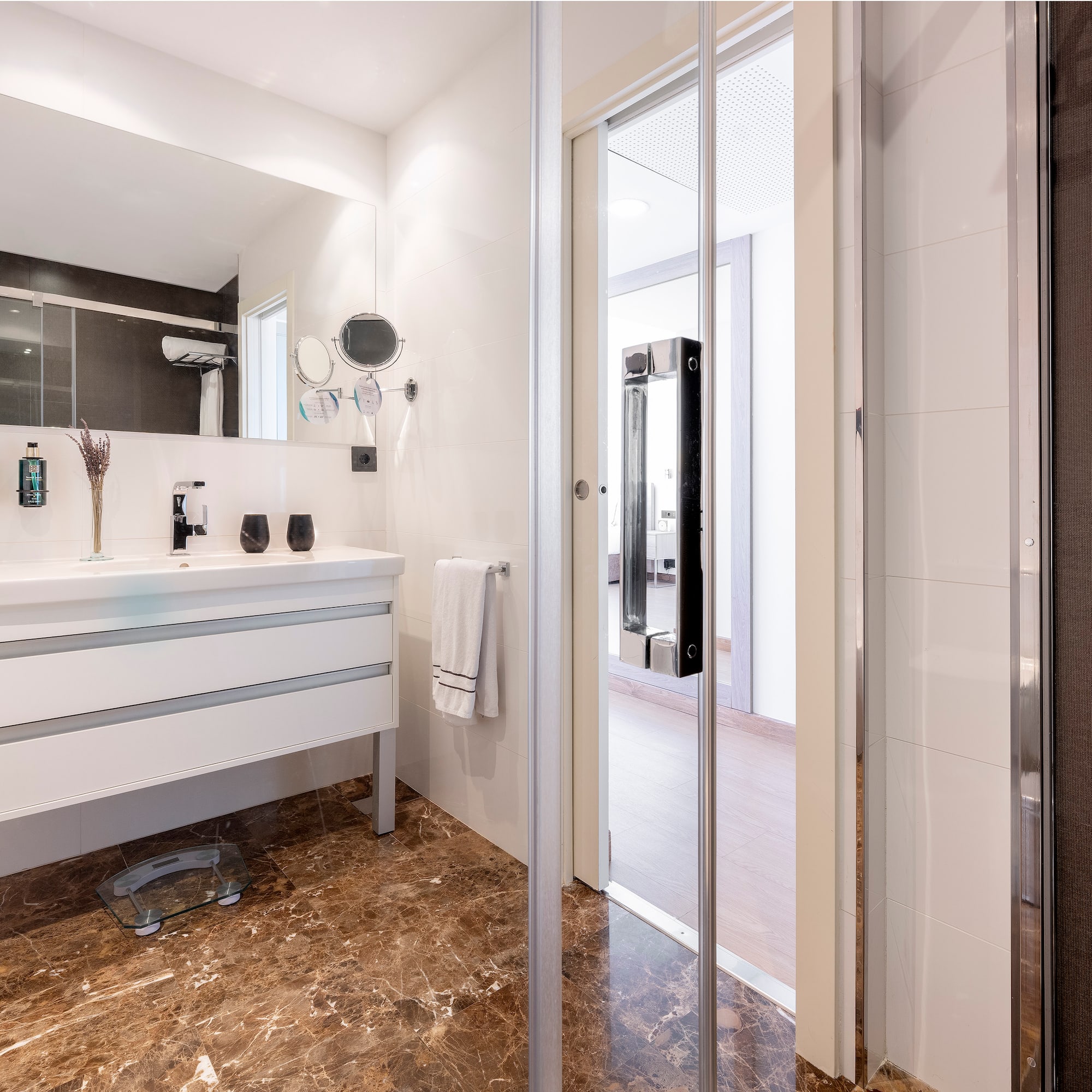 a bathroom with a glass door