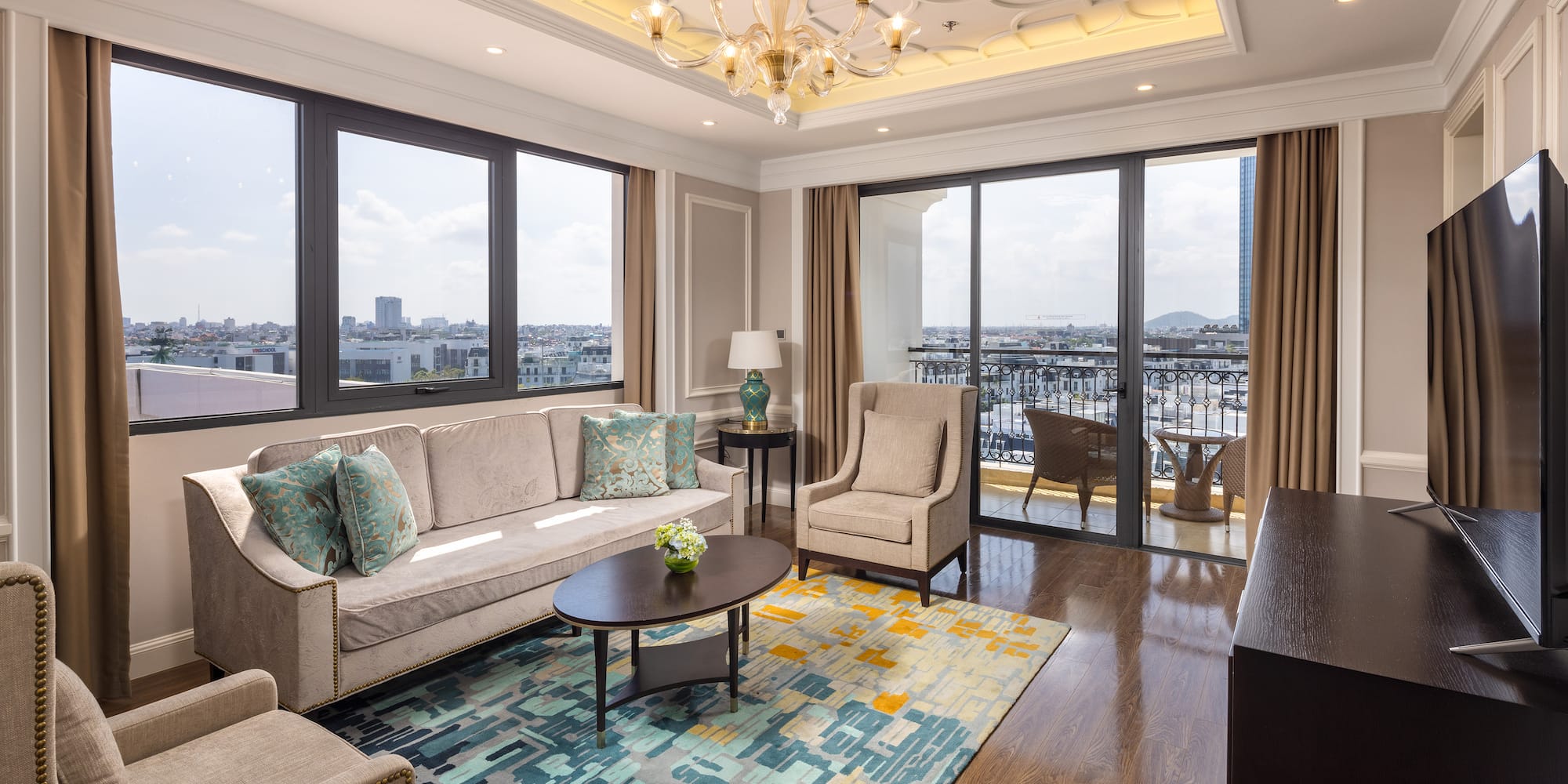 a living room with a chandelier and couches