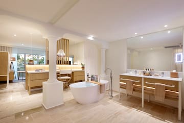 a bathroom with a tub and a sink