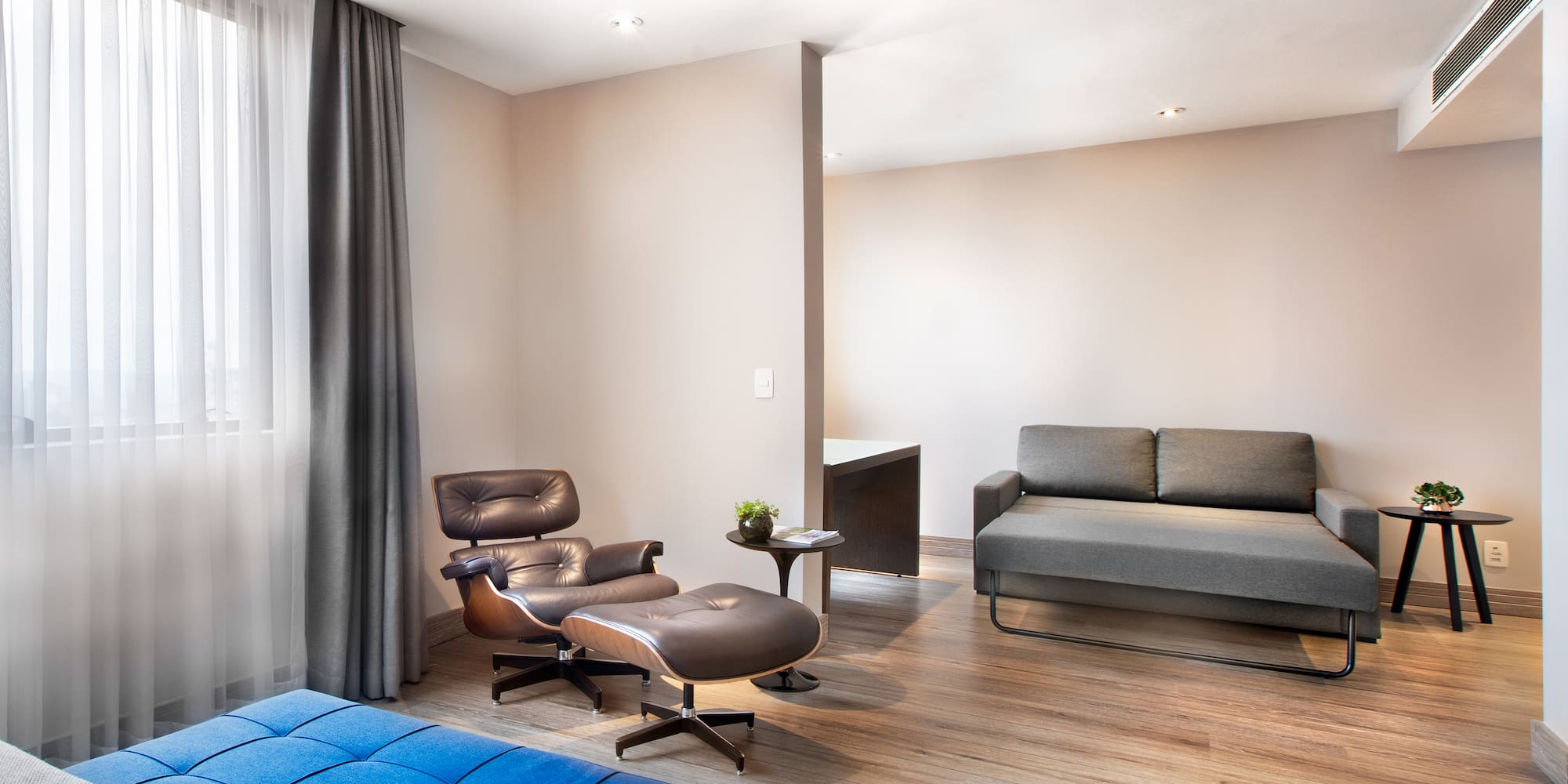 a room with a couch and a chair