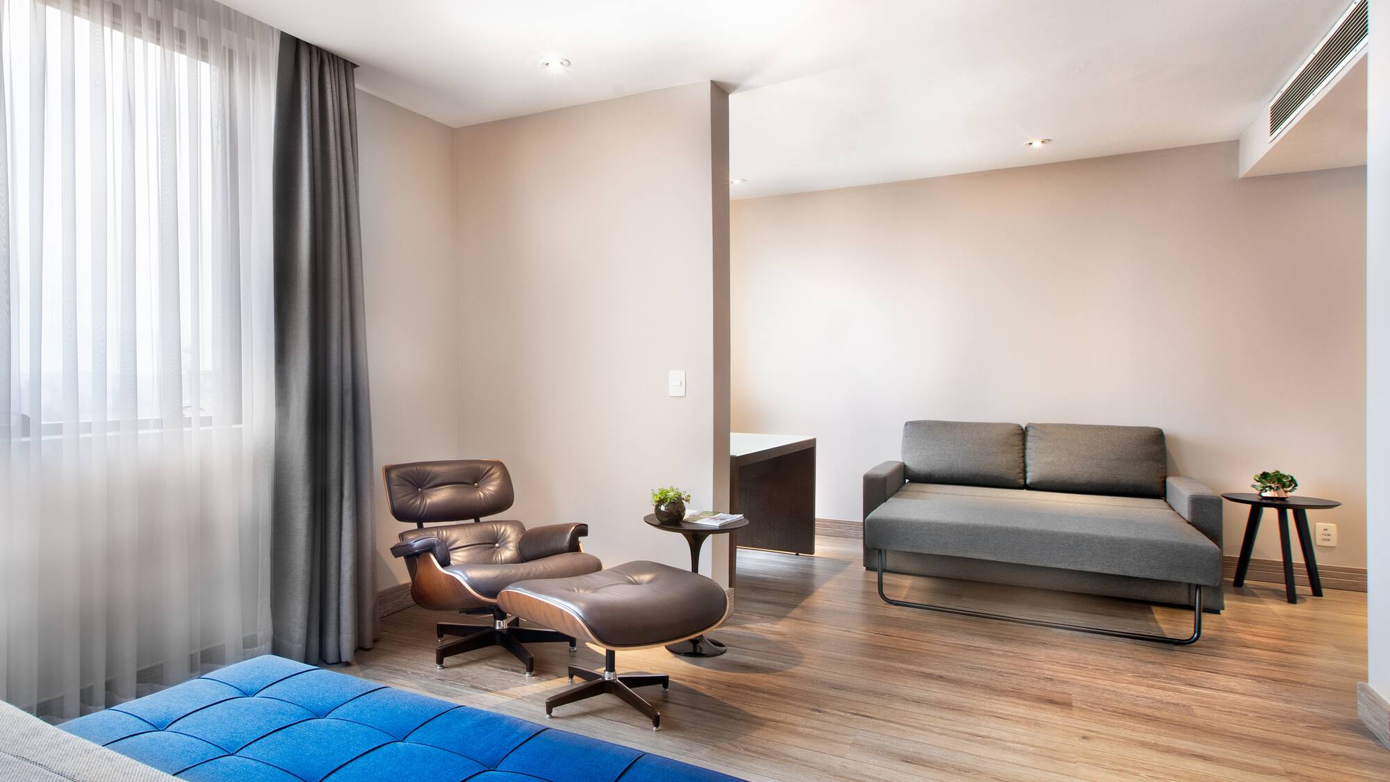 a room with a couch and a chair