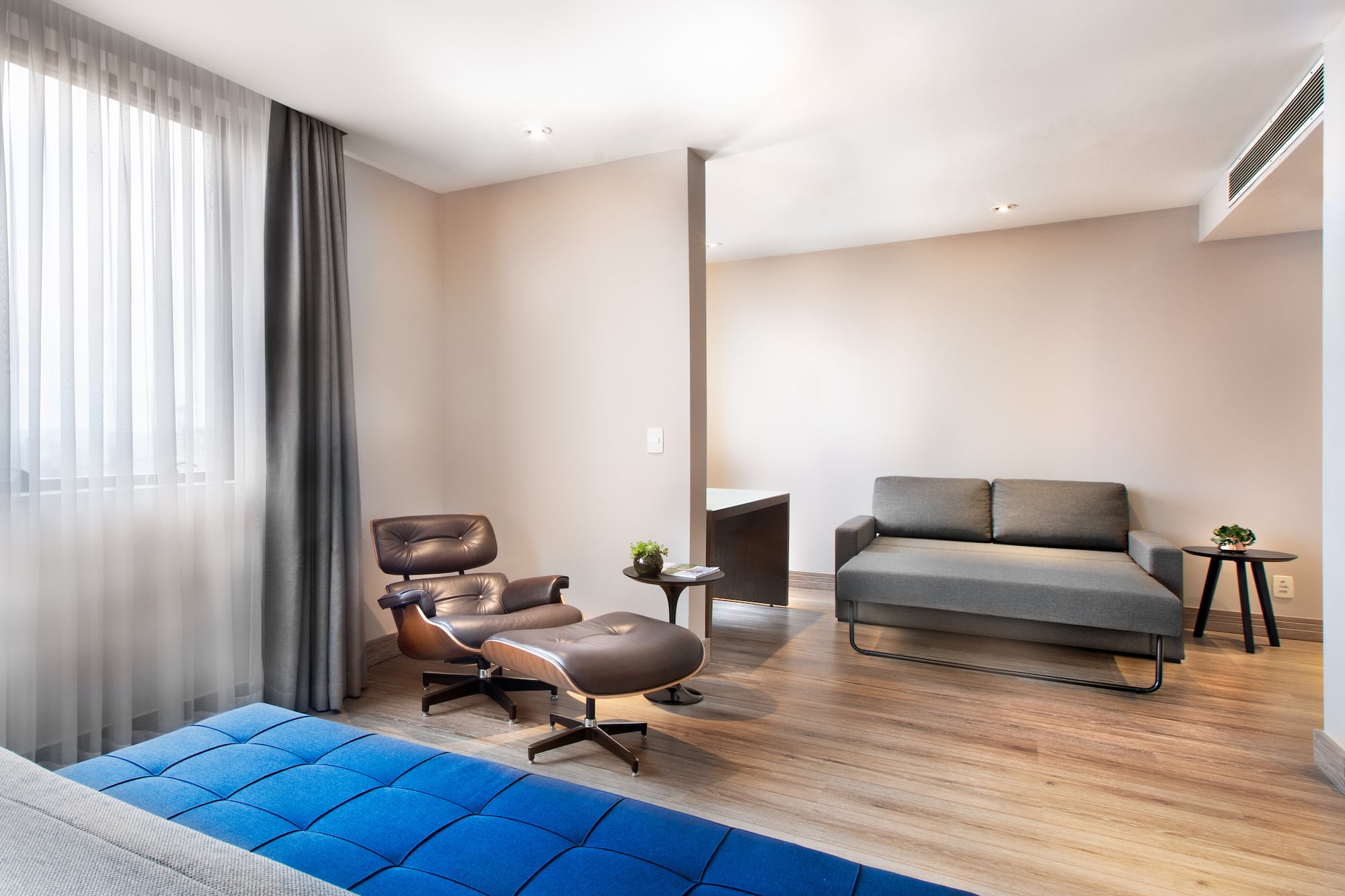 a room with a couch and a chair