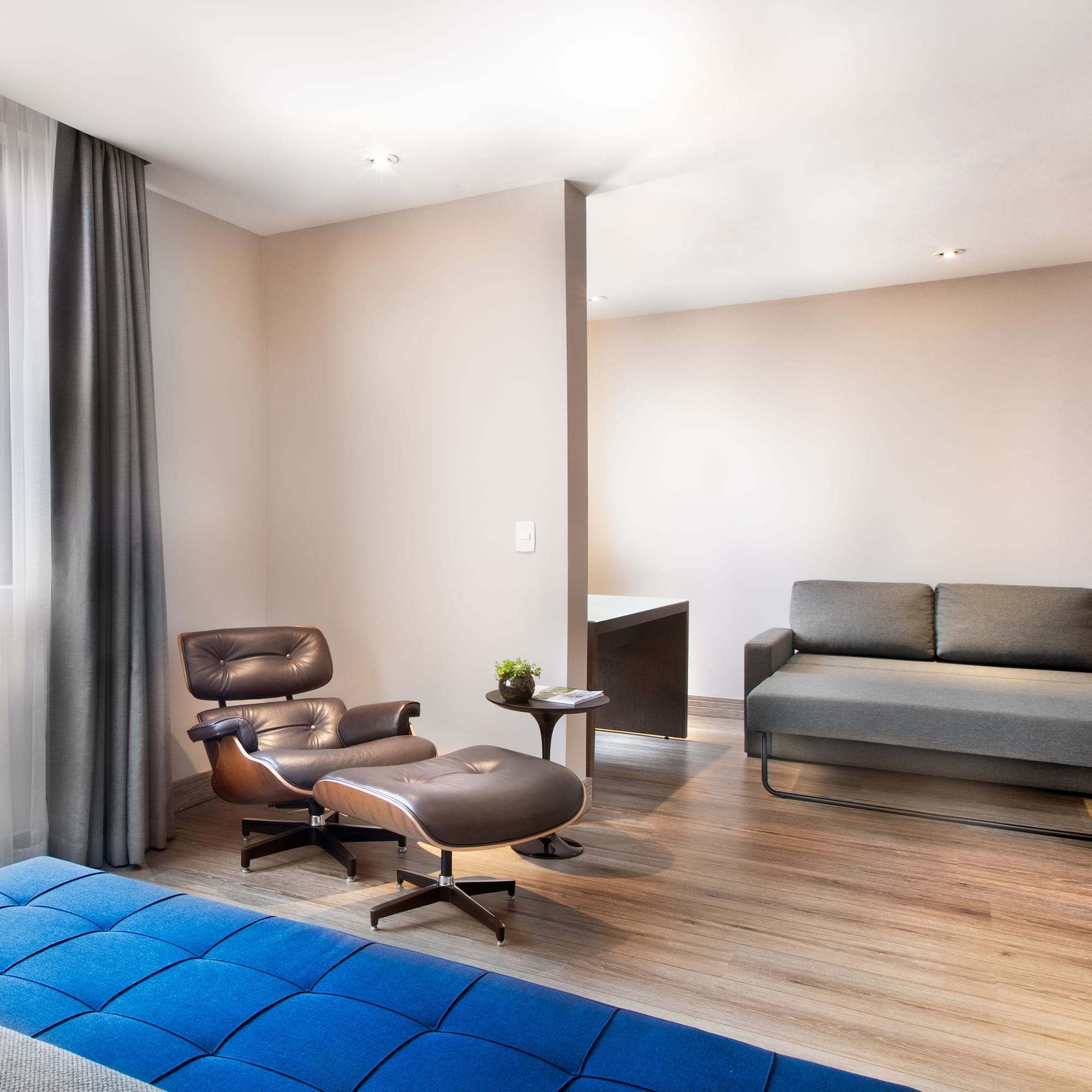 a room with a couch and a chair