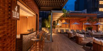 a patio with chairs and tables