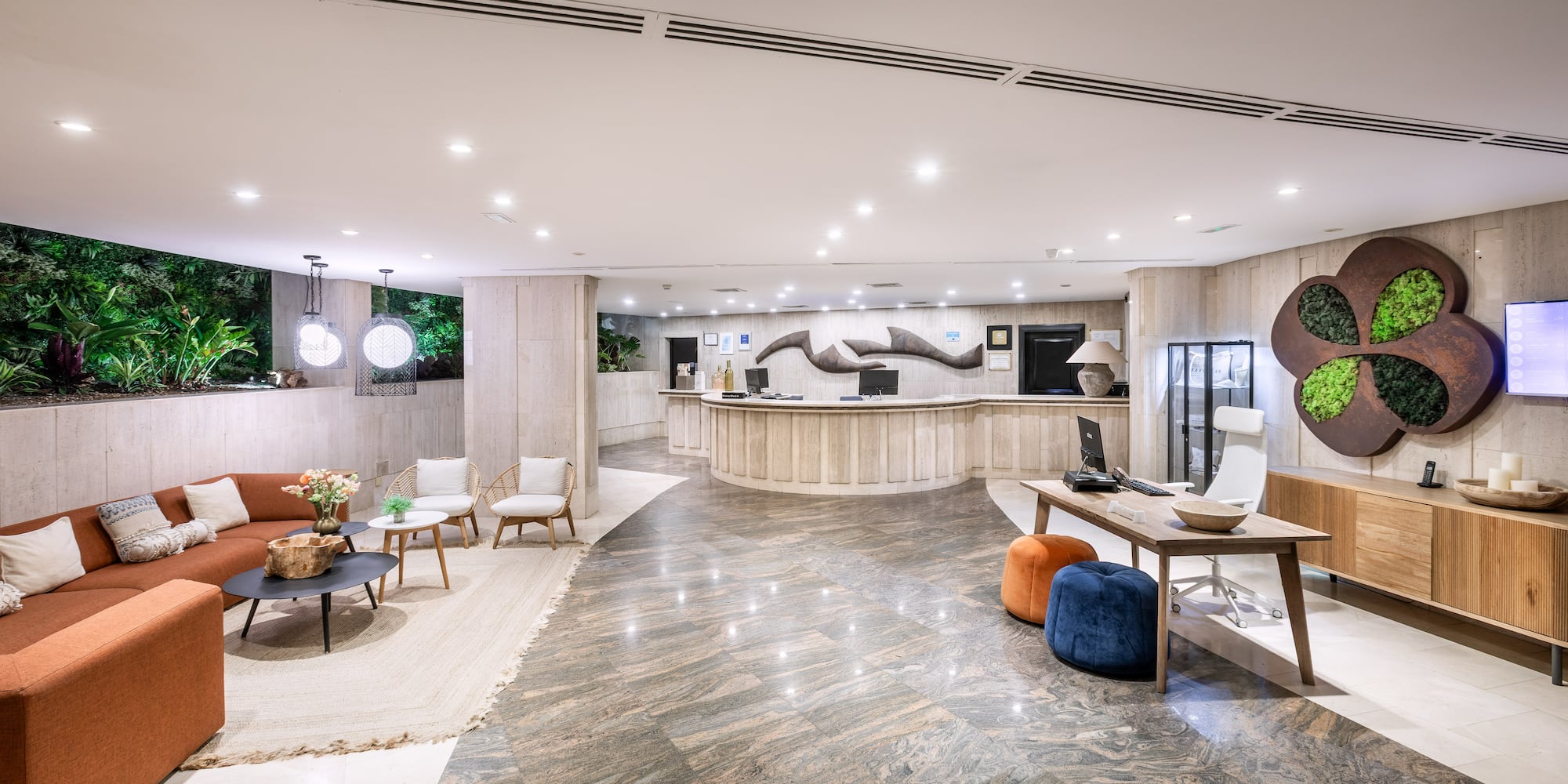 a lobby with a reception desk and chairs