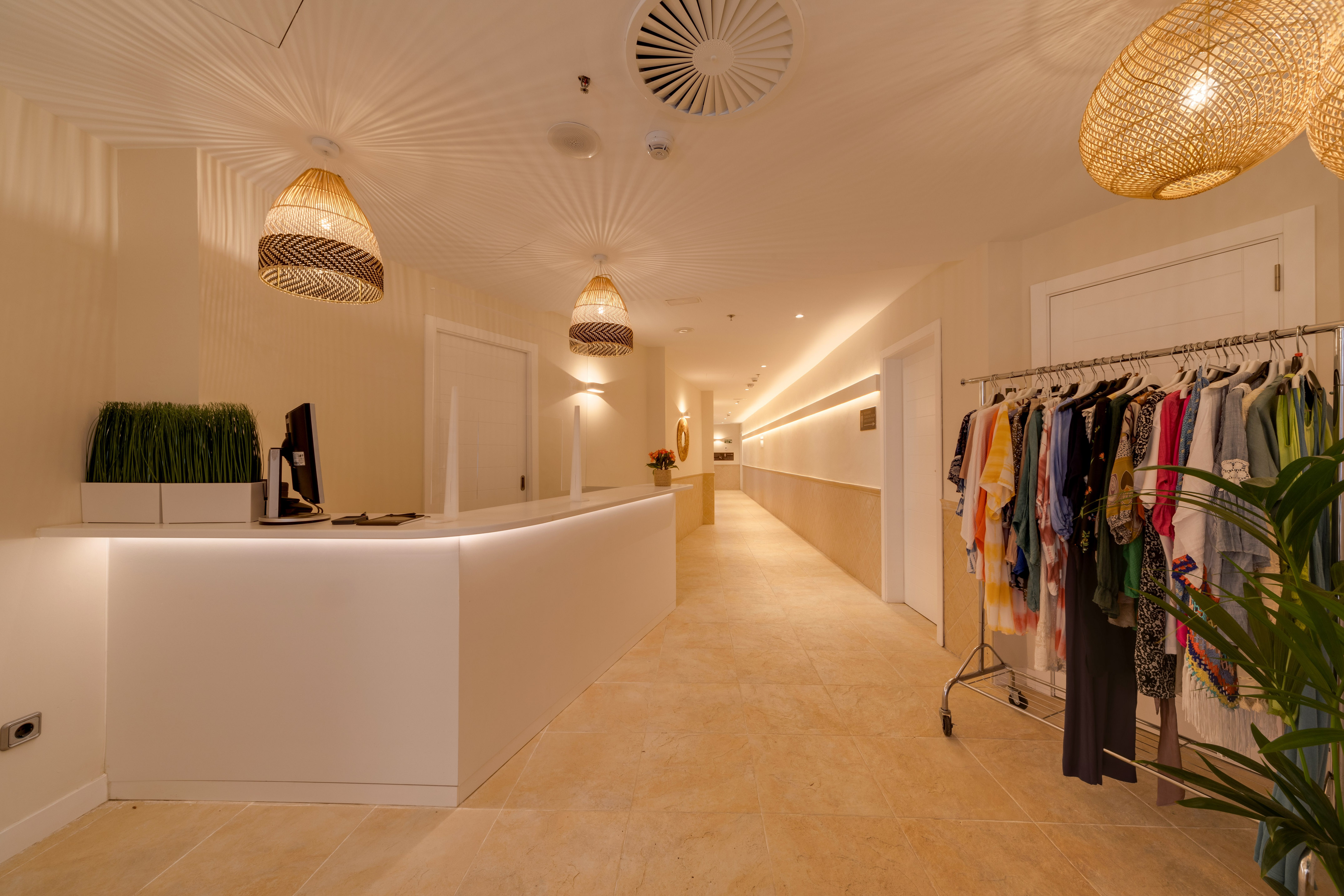 a store with a counter and clothes