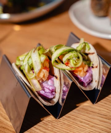 a group of tacos on a table