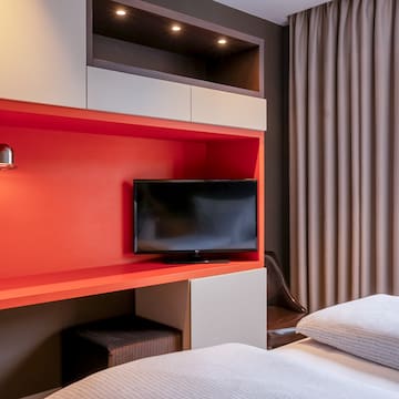 a tv on a shelf in a room