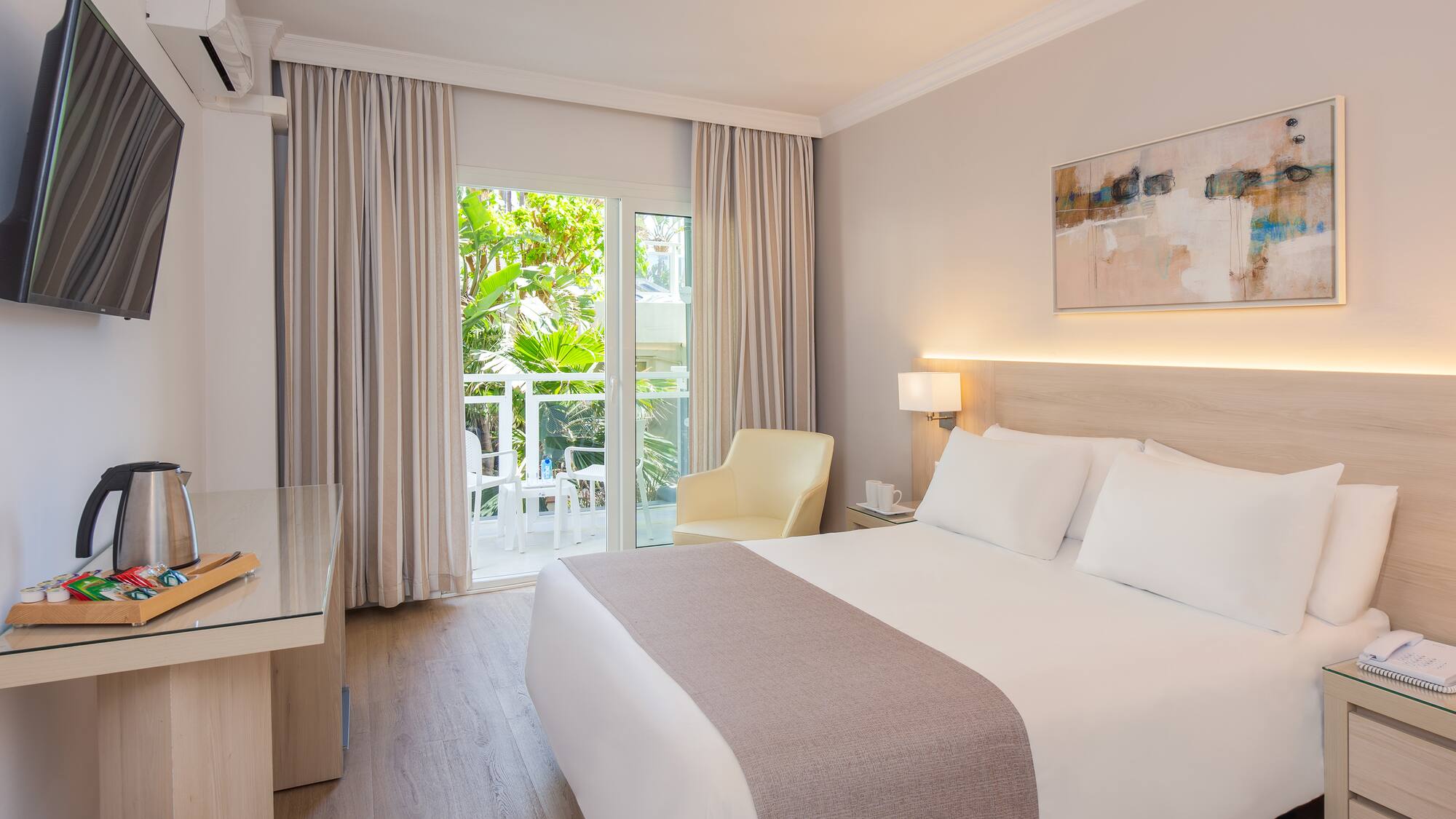 a bedroom with a bed and a desk