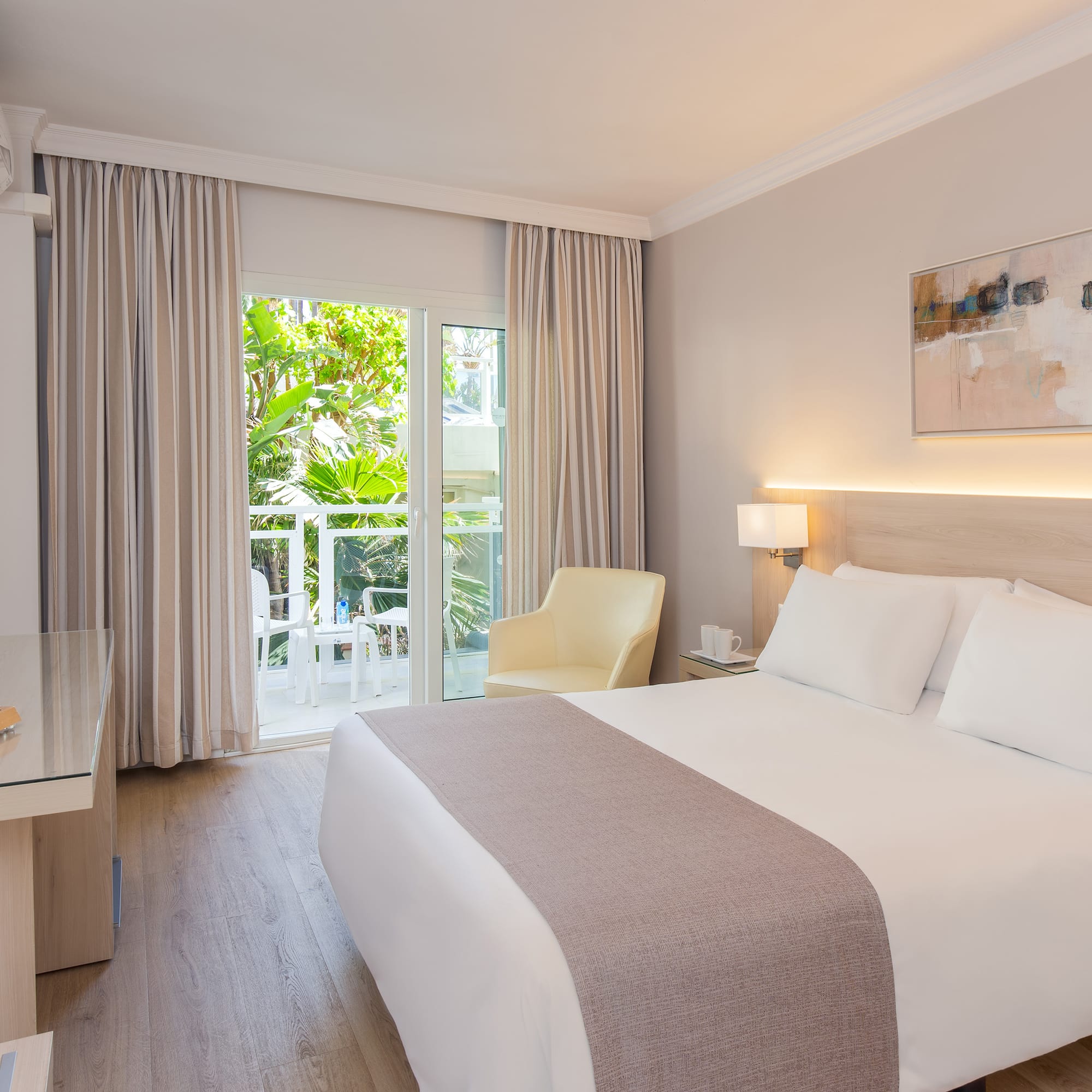 a bedroom with a bed and a desk