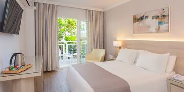 a bedroom with a bed and a desk