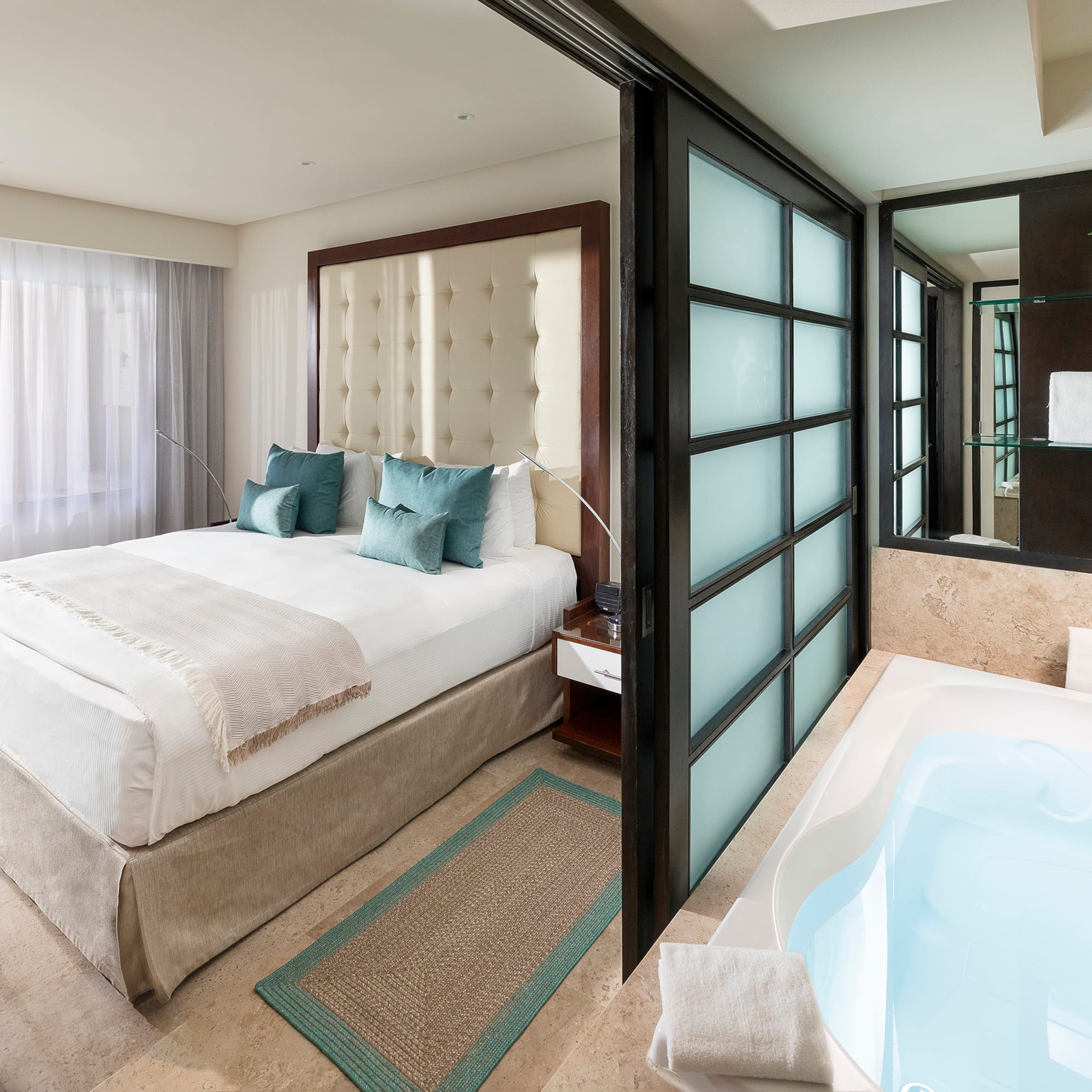 a room with a bed and a bathtub