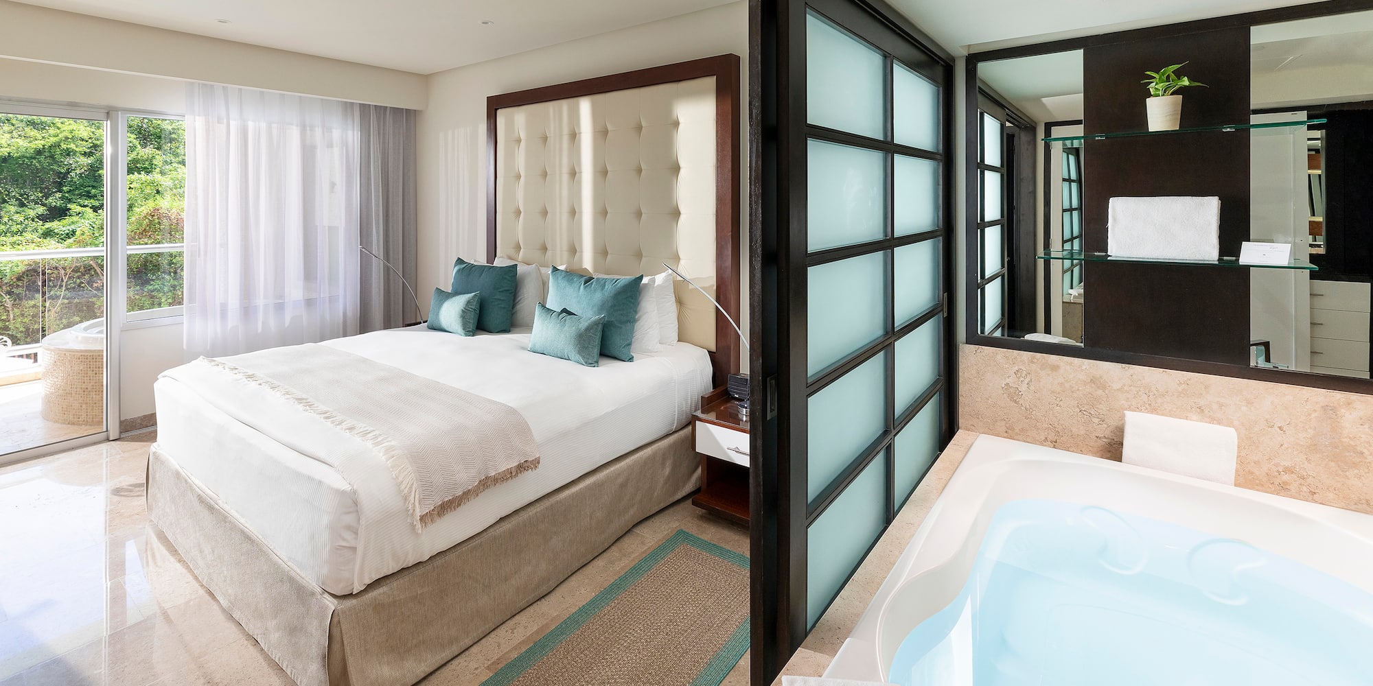 a room with a bed and a bathtub