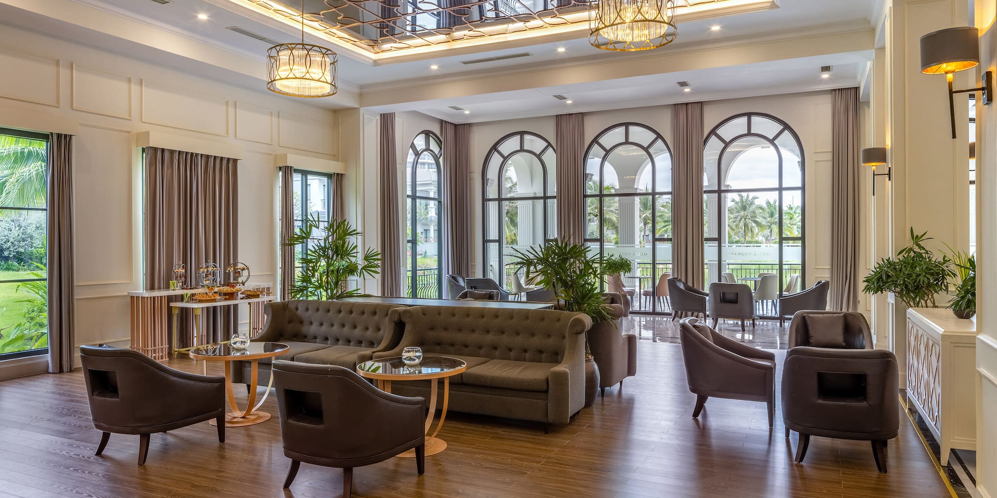 a room with a couch and chairs