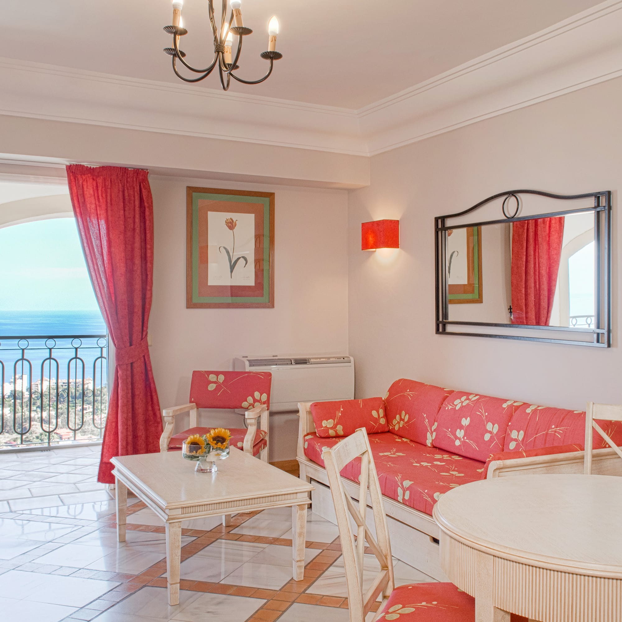 a living room with a couch and table and chairs