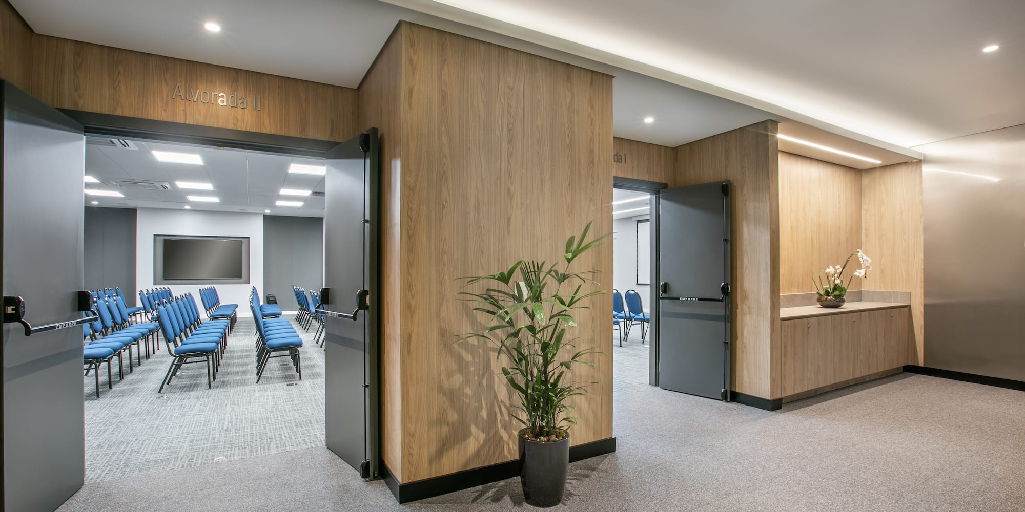 a room with chairs and a door